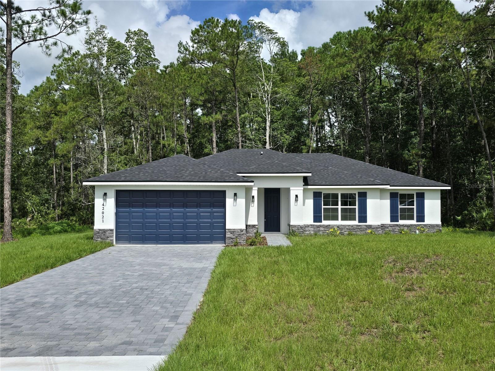 BRAND NEW HOUSE ON 1 ACRE LOT - HORSE FRIENDLY - BACKS ONTO 78 ACRES OF STATE LAND - MOVE-IN-READY !!! Beautiful new construction home in the desirable Royal Trails community, set on a spacious 1-acre lot and designed to give the perfect blend of modern comfort and peaceful country living. This RV-friendly community with deeded access to Lake Norris provides space, privacy, and a relaxed rural lifestyle while remaining conveniently located near everyday amenities. This thoughtfully designed residence features 4 bedrooms, 2 bathrooms, and a bright open-concept floor plan ideal for everyday living and entertaining. The kitchen will showcase modern finishes and quality upgrades, opening seamlessly to the main living area. Waterproof luxury vinyl flooring throughout the main areas adds both style and durability. Royal Trails offers a unique rural lifestyle with convenient amenities, including deeded access to Lake Norris, a community park, playground, pavilion, and approximately 26 miles of roads for walking and biking. Zoning allows up to two horses pr acre, and RV and motorhome parking are permitted. Surrounded by the Ocala National Forest and Seminole State Forest, this property also backs to approximately 78 acres of state-owned land, providing exceptional privacy and a beautiful natural backdrop with no rear neighbors. Yet it remains conveniently located near Eustis, Mount Dora, Deland, and Lake Mary, with easy access to the Wekiva Parkway and SR-429. Beaches, Orlando attractions, and both Orlando and Daytona International Airports are about an hour away. A rare opportunity to own new construction on acreage in Royal Trails. Schedule your showing today.