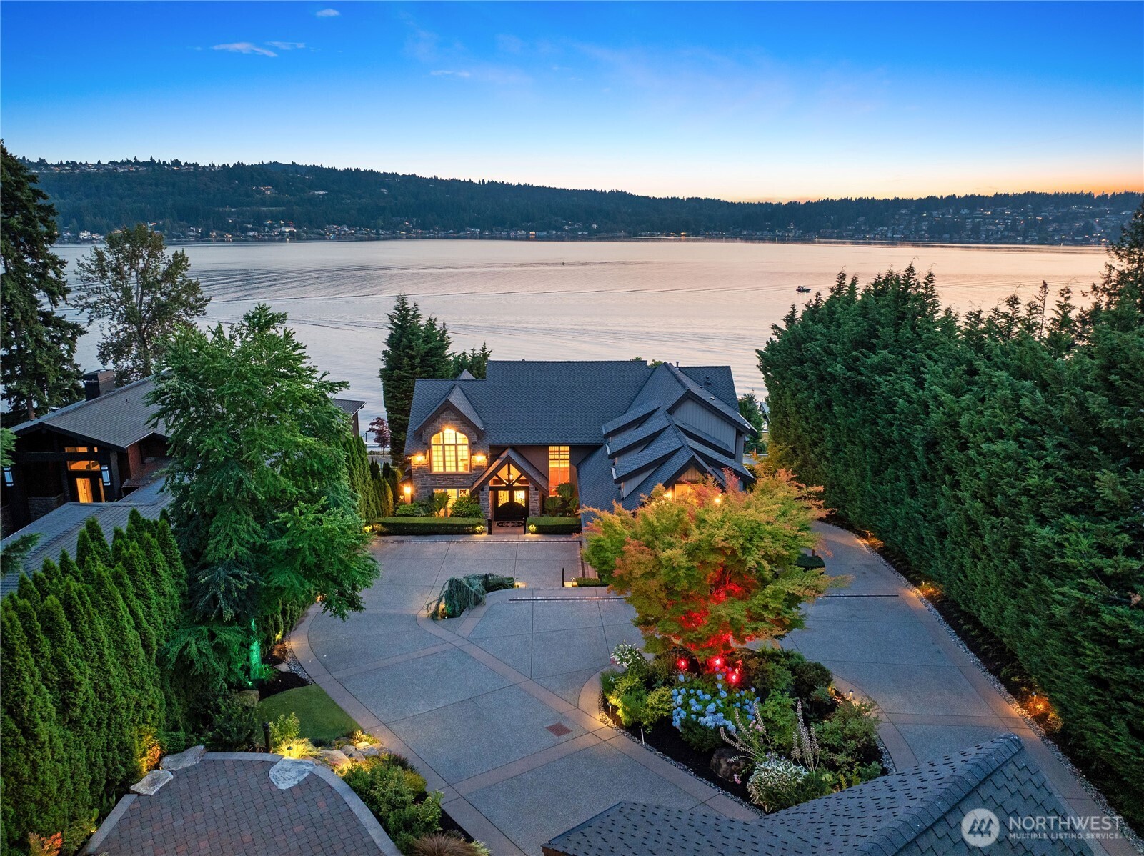 Gated Lake Sammamish waterfront estate with timeless architecture, four-car garage and exceptional curb appeal.