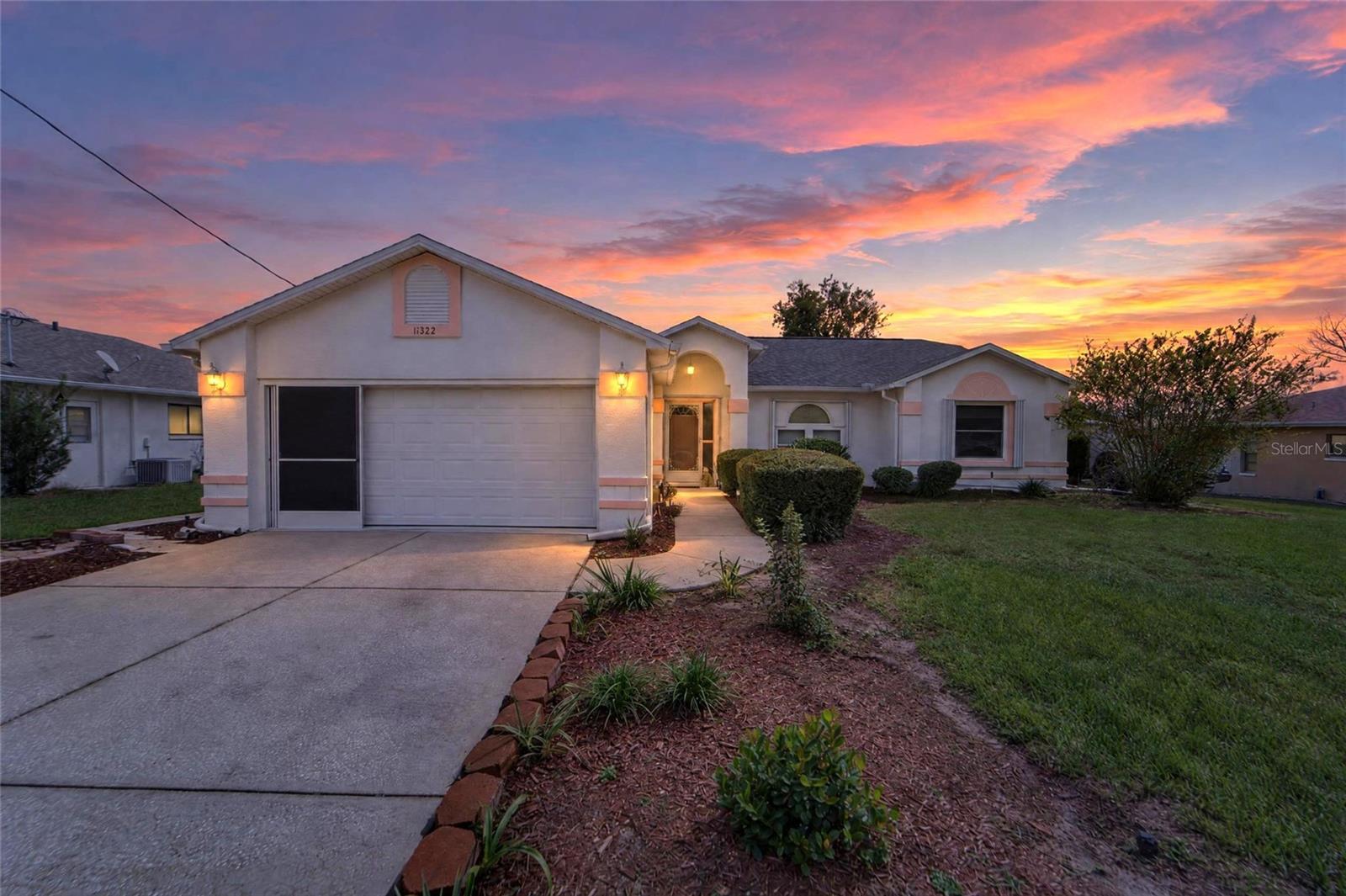 **Well-maintained 3-bedroom, 2-bath pool home with a 2-car garage, in excellent condition and ready for its next owner.** Enjoy Florida living in the screened-in pool area, with convenient pool access from the primary bedroom, kitchen, living room, and two additional bedrooms. Recent updates include a 2025 roof, 2025 HVAC system, 2025 water heater, a new pool filter and tank, and waterproof vinyl flooring in the living room. The home also features newer pool screening, double-pane windows throughout, and hurricane shutters for added peace of mind.Additional highlights include whole-house irrigation, an interior laundry room with washer and dryer and storage cabinets, and a wraparound walkway leading to a storage shed. Conveniently located near everyday amenities throughout Hernando County. Move-in ready and thoughtfully maintained, this home is a wonderful opportunity to enjoy a private pool and comfortable Florida living.