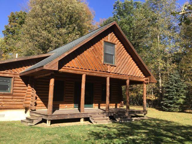 FULL HAND-SCRIBED RIVERFRONT LOG HOME!! This custom-built, 3-bdrm 2 bath full log home is in mint condition and nestled among 2.14 acres of gorgeous hardwoods and Colorado blue spruce trees with 336+ feet of frontage on the popular Au Gres River. Open floor plan, large rooms, vaulted ceilings, main floor laundry, main floor bedrooms, bedroom and bath in loft area w/possible 4th-bedroom, whole knotty pine interior, oak blinds on all windows, beautiful hardwood floors, water softener, new furnace installed in 2022, and new water heater w/osmosis water filter installed in 2023. Relax on your 28-foot covered back porch and enjoy the views of the Au Gres River or watch the abundance of deer, eagles and turkey in the area. Secluded for privacy yet just 12 miles to Tawas City for shopping, restaurants, art festivals and Lake Huron beach area. This secluded property is a MUST SEE and just steps from the beautiful Au Gres River where there is excellent salmon and trout fishing!!