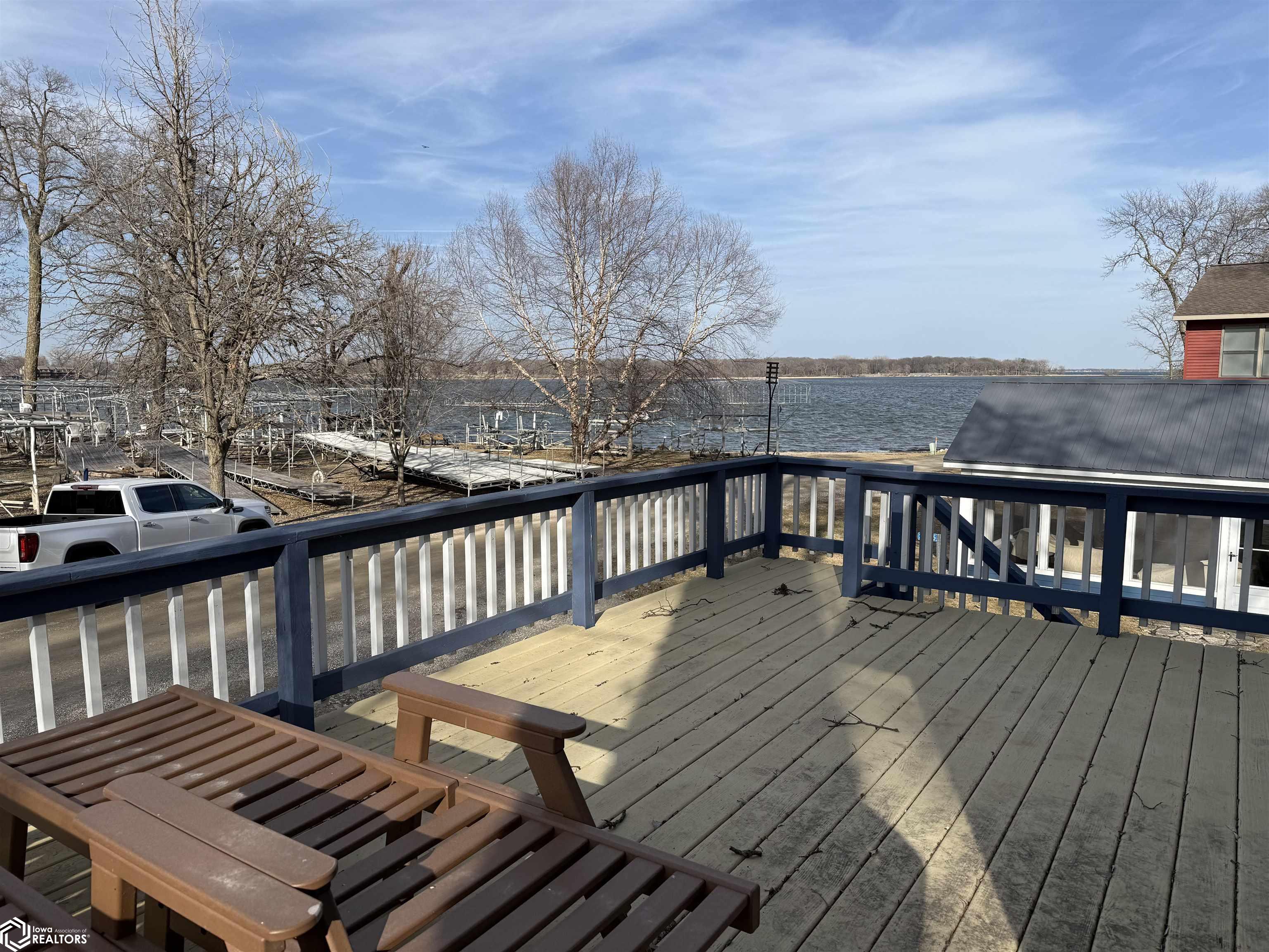 This is a great opportunity to get to the lake! This 2-bedroom turn-key cabin is just steps to the water, with potential lake access and a place for your boat. Solar-powered lift and cover included. Enjoy the gorgeous lake views while lounging on the deck or patio. A newer 3-stall garage was built in 2018 and has all the bells and whistles. Perfect for the boat and all the lake toys. Call your Realtor today and get ready for summer at the lake.