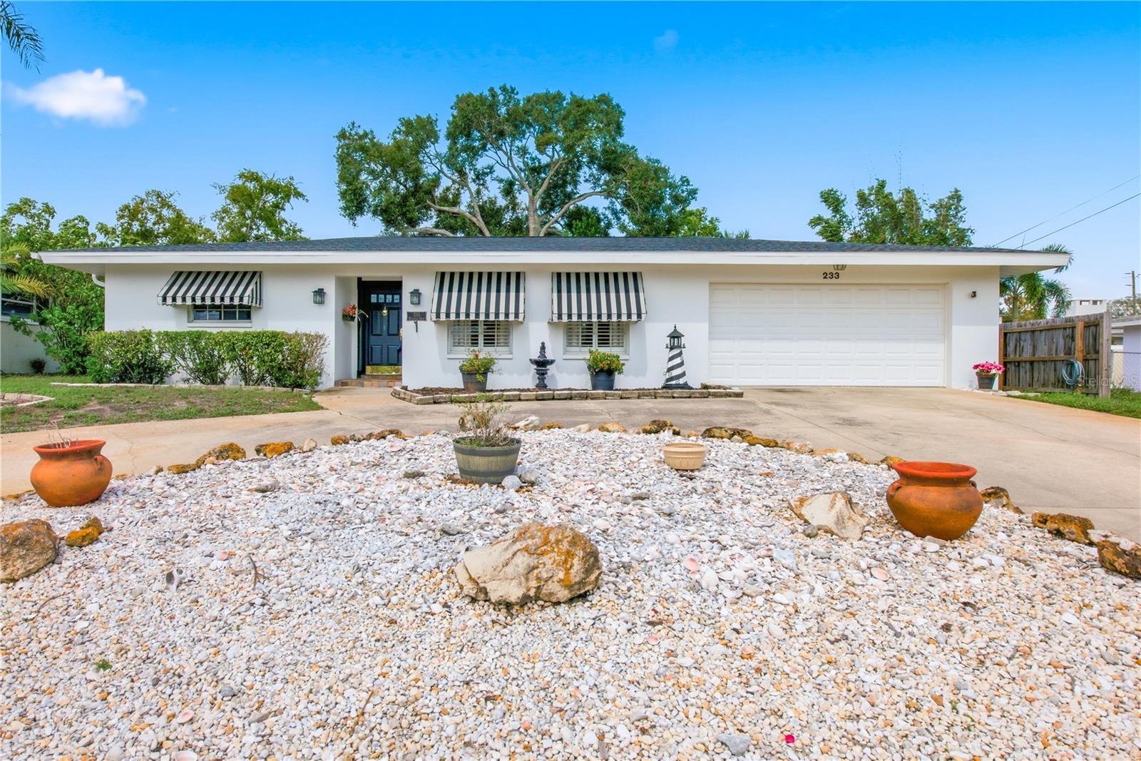 Every home has something that makes it special. Others stand out for the lifestyle they make possible! In Palm Harbor’s Baywood Village, this 3-bedroom, 2-bathroom pool home offers something special: room to enjoy Florida living on your own terms. With 1,660 square feet, a 2-car garage, circular driveway, and screened-in swimming pool, there is plenty to appreciate both inside and out.The functional floor plan includes separate living and dining areas, a spacious family room overlooking the pool, a private primary suite, two additional bedrooms with a shared bath, and an indoor laundry room. Plantation shutters and crown molding add timeless character, while a 5-year-old AC, new electrical panel, second water heater, and newer exterior paint are among the property's practical highlights!The screened pool and fenced backyard set the scene for sunny afternoons, casual dinners outdoors, and weekends spent enjoying the Florida sunshine. Better yet, Baywood Village has no deed restrictions and no leasing restrictions, offering flexibility for a full-time residence, seasonal retreat, or investment opportunity. Bring your golf cart, RV, and recreational toys, and enjoy options that can be harder to find in deed-restricted communities.An optional paid clubhouse membership is available for those who want to enjoy additional community amenities. Baywood Village also hosts neighborhood gatherings, including golf cart parades and fishing tournaments! Beyond the neighborhood, enjoy convenient access to Honeymoon Island, Fred Howard Park, Sunset Beach, Wall Springs Park, the Pinellas Trail, and Innisbrook Golf Resort. Historic downtown Tarpon Springs and its famous Sponge Docks add another local favorite for waterfront dining, shopping, and Greek culture.A private pool, a Palm Harbor address, and the freedom to make the property your own.Whether you're searching for a place to call home, a Florida getaway, or an investment opportunity, this is one worth seeing in person! *This home did not flood during the 2024 hurrincanes!*