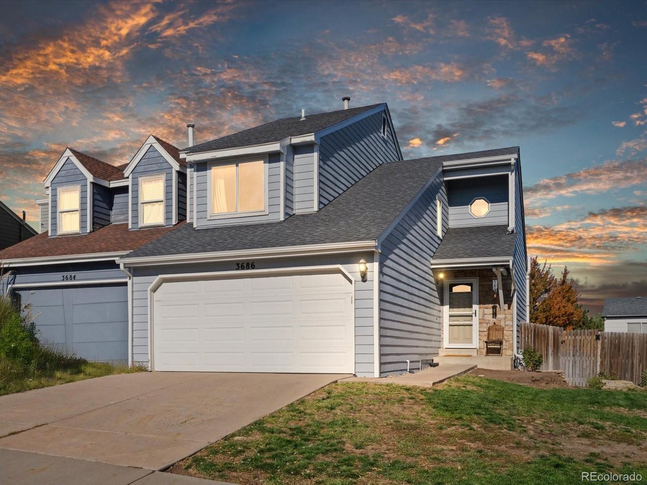 This updated townhome offers a rare single-family duplex feel with its own private yard. The main level features soaring ceilings & skylights in the living room giving abundant natural light. It also features a beautiful remodeled kitchen, updated half bath and dining area. Upstairs includes a flexible loft, two bedrooms, and an updated full bathroom.Outside, enjoy a private fenced yard with a newer Trex deck and concrete patio. Major updates include the kitchen (2020), exterior paint, roof, gutters, and skylights (all 2021), Trex deck and concrete (2023), bathrooms (2025 & 2026), HVAC (2016) and Radon mitigation system. With such a cute private yard, extensive updates, and **NO HOA**, this one is a rare find and won't last!!