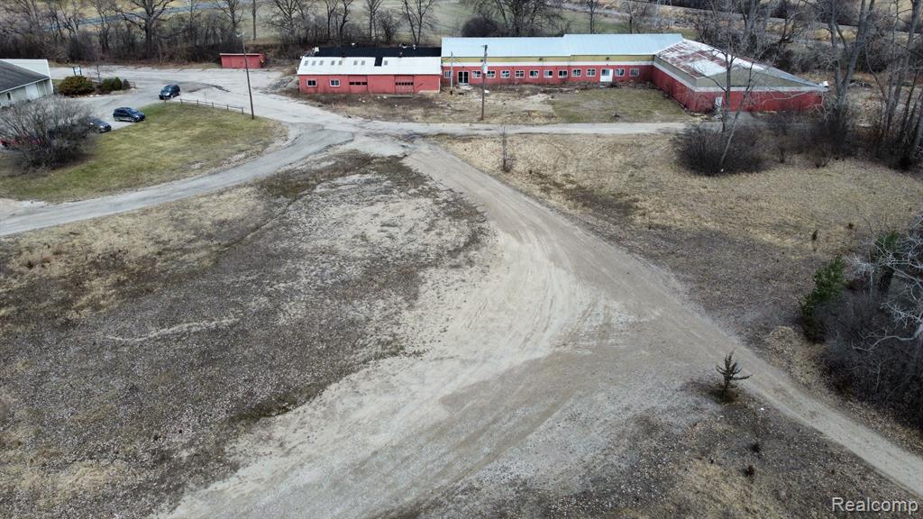 Visible from US-23 and M-14 this property was home to Cornwell Pools. Consisting of two adjacent parcels comprising 5 total acres available for development. The original buildings, showroom and warehouses remain on the site