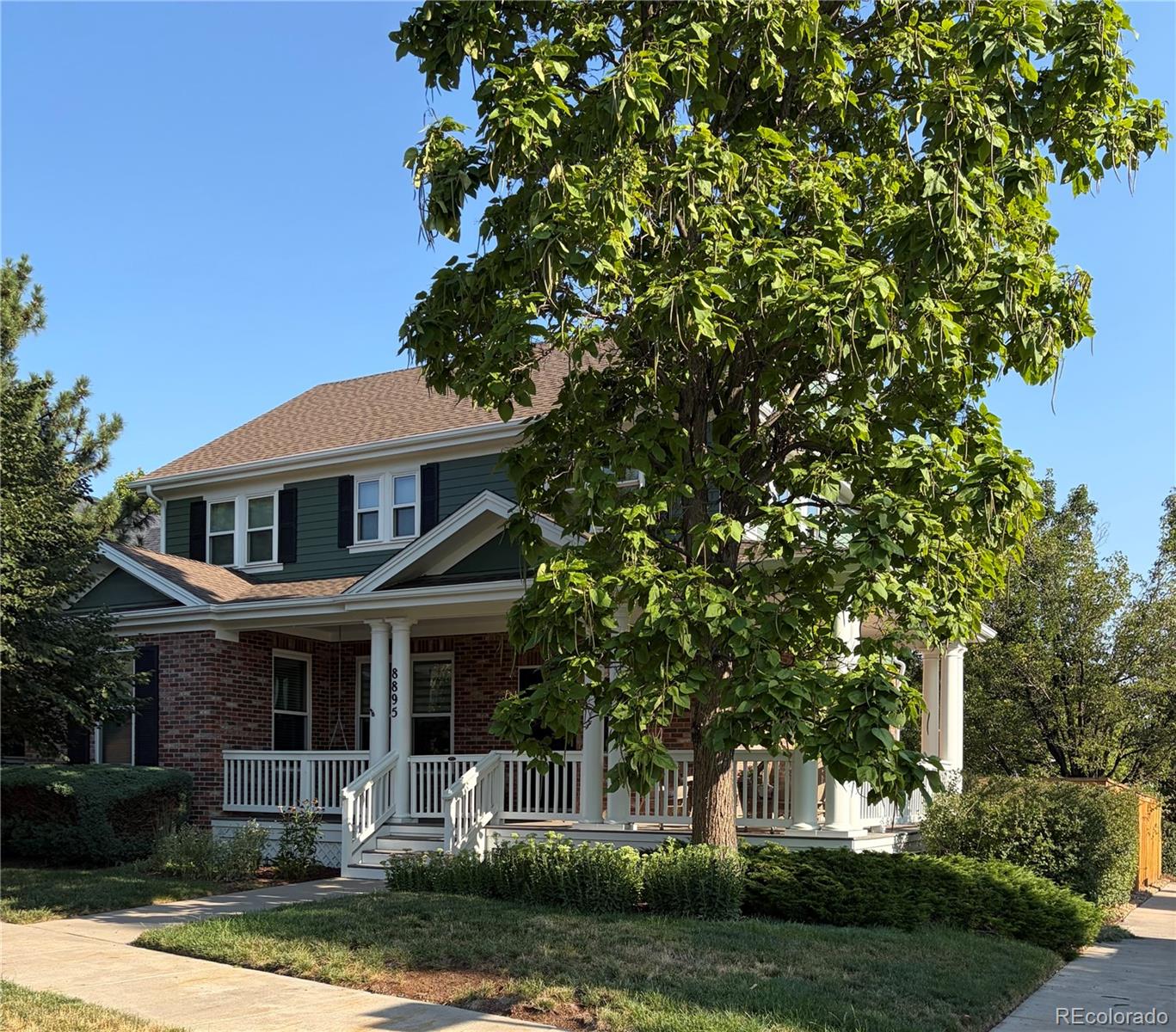 Beautifully updated & meticulously maintained, this 1-owner home blends timeless style with modern improvements. Perfectly situated on a corner lot, the inviting wraparound covered front porch creates the ideal place to enjoy Colorado's beautiful days! Fresh interior paint, newly refinished hardwood floors, and brand-new carpet make this home truly move-in ready. A dramatic vaulted foyer welcomes you inside, flanked by an elegant formal dining room before opening to the spacious great room, where a cozy fireplace creates a warm gathering space. All overlooking the beautifully remodeled kitchen that showcases white quartz countertops, designer tile backsplash, prep island, pantry,& abundant cabinetry.  Tucked away for privacy, the main-floor office is conveniently located adjacent to the remodeled powder bath featuring marble finishes & classic wainscoting. Upstairs, oversized windows flood the staircase with natural light. 2 secondary bedrooms share a Jack-and-Jill bath, while the spacious primary suite features a beautifully remodeled 5-piece bath with quartz countertops, updated fixtures &lighting, frameless glass shower enclosure, & a soaking tub. Thoughtfully designed for studio-style living, the finished basement offers an ideal private retreat for a multigenerational living, extended guests, or flexible living space! Featuring built-in cabinetry, in-wall speakers, & a stylish kitchenette, this versatile space offers the potential for a non-conforming 4th bedroom and exceptional flexibility. Addt'l improvements: triple-pane windows (2021), exterior paint & new fencing (2025), Level 2 EV charger, 100 watt solar panel and 12V battery storage in garage, radon mitigation system, smart thermostat, electronic locks, whole-house humidifier, SimpliSafe security system. This lovingly cared-for home sits just moments from exceptional parks, trails, schools, pools, 2 Town Centers, neighborhood Rec Center, & Stanley marketplace!