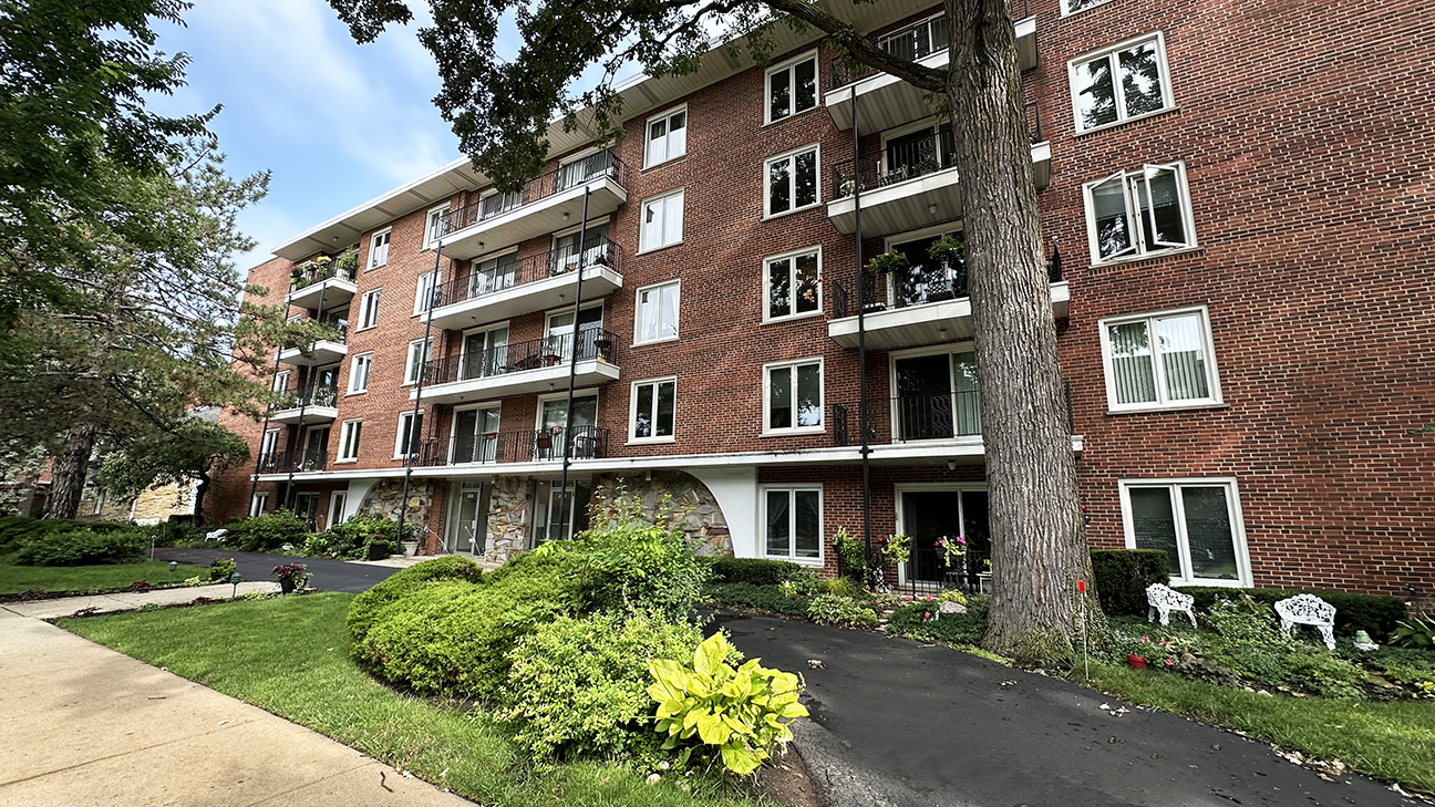 This rarely available top-floor condo in the Central Terrace complex features a desirable southern exposure, filling the home with abundant natural light. Ideally located just steps from the vibrant shops, dining, and amenities of Evanston's Central Street, the unit offers two bedrooms and two full baths, including a large primary bedroom with a walk-in closet. The home features an eat-in kitchen with a brand-new microwave, a spacious living and dining area highlighted by a gracious foyer entry, and an updated electrical panel (2021). A new HVAC system was installed in 2019. Enjoy outdoor living on the full-length balcony, accessible from both the living room and second bedroom, overlooking parks. The unit includes one heated garage parking space with overhead storage, as well as an additional full storage unit on the first floor.