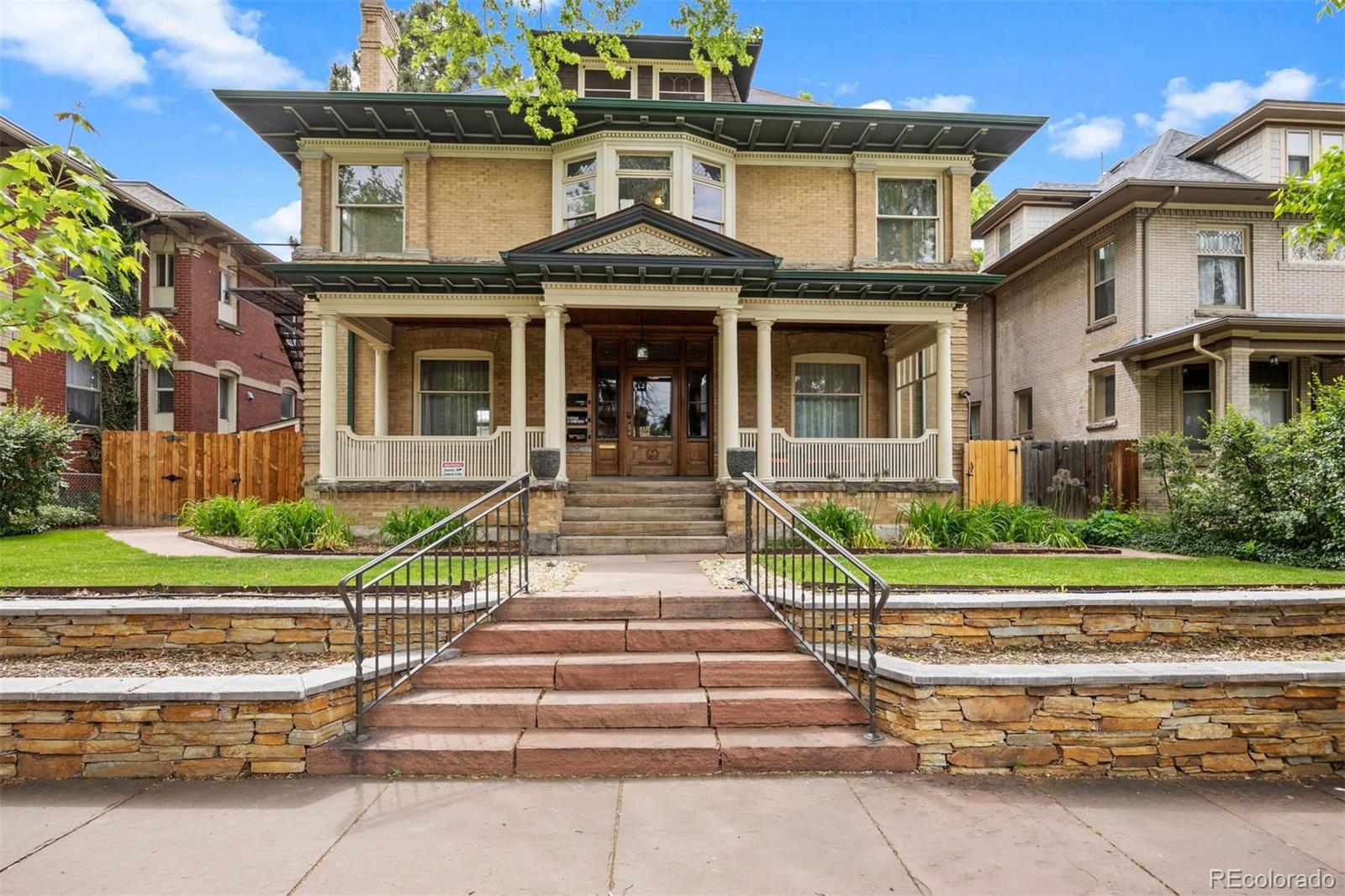 Timeless character and incredible flexibility come together in this 1905 Revival-style home in the heart of Congress Park. Located within a designated historic district, this 5,480 sq. ft. residence is filled with original details including stained glass, intricate woodwork, pocket doors, tile fireplaces, and classic radiators.Currently configured into three living spaces, the home offers a variety of options—restore it to a stunning single-family residence, create a multi-generational layout with separate exterior entrances, or live in one unit while generating income from the others. The largest residence spans two levels with 3 beds/3 baths, ideal for an owner-occupant. Two additional units (2 bed/2 bath and 1 bed/1 bath) are tenant-occupied on month-to-month leases. Tenants are open to staying, providing immediate income, or vacating to allow for a full conversion.The current owners had planned a single-family transformation and are happy to share their vision, plans, and preliminary budget. Renovated single-family homes nearby are currently trading around $3.5M, highlighting the long-term upside.Recent updates include a new boiler, city-compliant fire escape, underfloor heating, updated bathrooms, new landscaping, retaining wall, patio, outdoor lighting, sprinkler system, smart lighting, CCTV, and electronic keypads. Additional features include two laundry areas, off-street parking, and a fully fenced yard.There is also space to add a 2–3 car garage off the alley, with potential for an ADU above (buyer to verify).Just blocks from City Park, Denver Botanic Gardens, Cherry Creek, and neighborhood favorites like Shells & Sauce and Genesee Coffee—this is a rare opportunity to create something truly special in one of Denver’s most sought-after neighborhoods.Surrounded by mature trees and highlighted by original stained glass windows, the home offers a rare blend of privacy, charm, and architectural beauty.