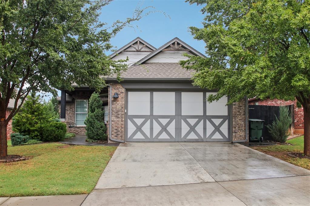 Cute from the curb and just as impressive inside! Built by Landmark Fine Homes, this immaculate home is ready for you to move right in and start enjoying it. Mature landscaping, a stained sidewalk, and a covered front porch with a swing welcome you before you even reach the door. Inside, an open floor plan, plantation shutters, and a mix of wood, tile, and carpet floors create a warm, inviting feel. The kitchen features acid-washed granite, gas range, built in microwave, tile backsplash and a farmhouse sink, with plenty of connection to the living and dining spaces for easy entertaining. Matching granite in the bathrooms carries the thoughtful finishes throughout the home. The charm continues out back, where a pergola and patio with gas hookup make it easy to enjoy dinner outside or unwind at the end of the day. An epoxied garage floor and storm shelter add practical touches to this beautifully kept home. And the best part? You can leave the mower behind! The HOA covers mowing and fertilizing the front and back yards, plus turning the mulch and weeding the front beds. It also includes gated entry, common area maintenance, a clubhouse, gym, saltwater pool, fishing ponds, and walking trails. Head next door to Greenleaf Trails for additional walking paths and a splash pad. Less upkeep, more time to enjoy where you live!