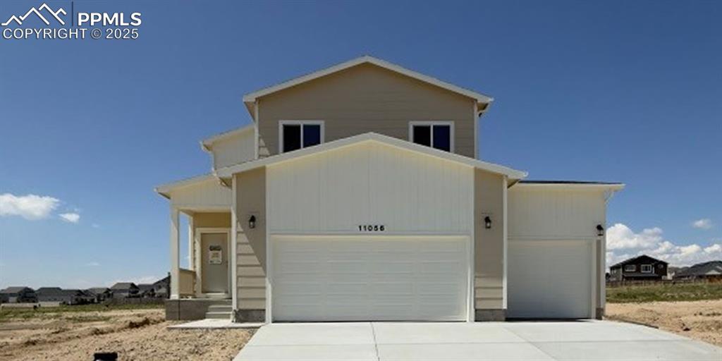 This home boasts a spacious kitchen with a walk-in pantry, 42” upper cabinets with molding, a 30” double oven gas range, microwave oven, disposal and dishwasher, plus the expanded kitchen island with two pendant lights.  The durable, yet luxurious vinyl plank flooring unifies the main living space. The primary suite is on the upper level along with two additional bedrooms, a second full bath, and a spacious loft. There are two more bedrooms and a full bath in the finished basement, as well as a 20x12 rec room. Enjoying the Colorado outdoors is easy with the 20x15 patio with pre-installed gas line for BBQs. The 3-car garage has the 2’ expansion and this home includes air conditioning as well.