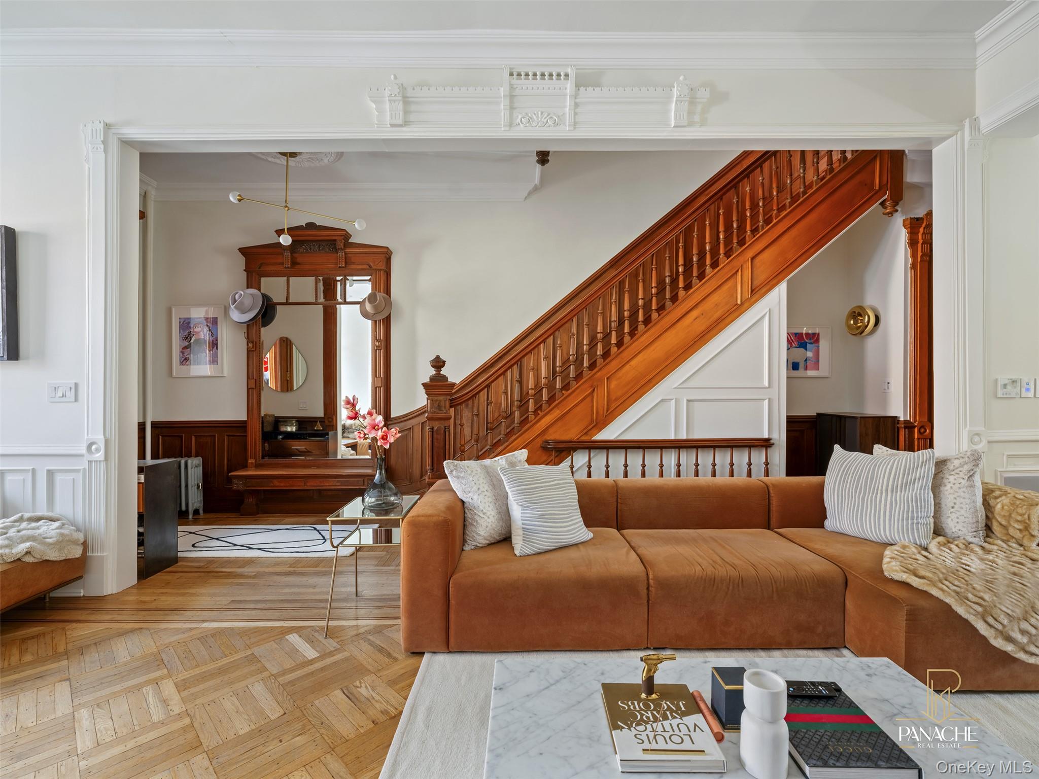 Welcome to 400 Putnam Avenue, a stately brownstone in the heart of Bedford-Stuyvesant that blends historic character with modern luxury.The expansive owner’s triplex boasts soaring 11-foot ceilings, original pier mirrors, and ornate crown moldings paired with modern comforts. A chef’s kitchen with a full Viking appliance package opens to a private balcony, creating the perfect setting for indoor–outdoor entertaining. Gracious living and dining areas are anchored by five fireplaces, blending decorative charm with functional warmth.  Five bedrooms plus a dedicated office provide ample space for living and entertaining. The primary suite includes spa-inspired baths, in-unit laundry, and direct access to a private terrace with hot tub.Outdoor living is exceptional, with three levels of private space: two balconies that cascade down a winding staircase to the landscaped garden-level courtyard. A finished cellar with a full bath offers flexible recreation or guest space, all enhanced by an integrated Sonos sound system.On the garden level, a one-bedroom rental with courtyard access and a guest suite offer flexibility for income-producing potential, extended family, or private accommodations.Set on Putnam Avenue, named for Revolutionary War hero Israel Putnam, this address is steeped in Brooklyn history. From early trolley lines to landmark architecture like the Lincoln Club and Shaari Zedek Synagogue, the neighborhood reflects a rich cultural legacy while evolving into one of today’s most dynamic communities.Perfectly positioned near Clinton Hill, 400 Putnam offers tree-lined streets, boutique shops, acclaimed dining, and excellent transit access. Whether as a luxurious primary residence, multi-generational home, or savvy investment, this brownstone is a rare opportunity to experience timeless Brooklyn living with modern comforts.