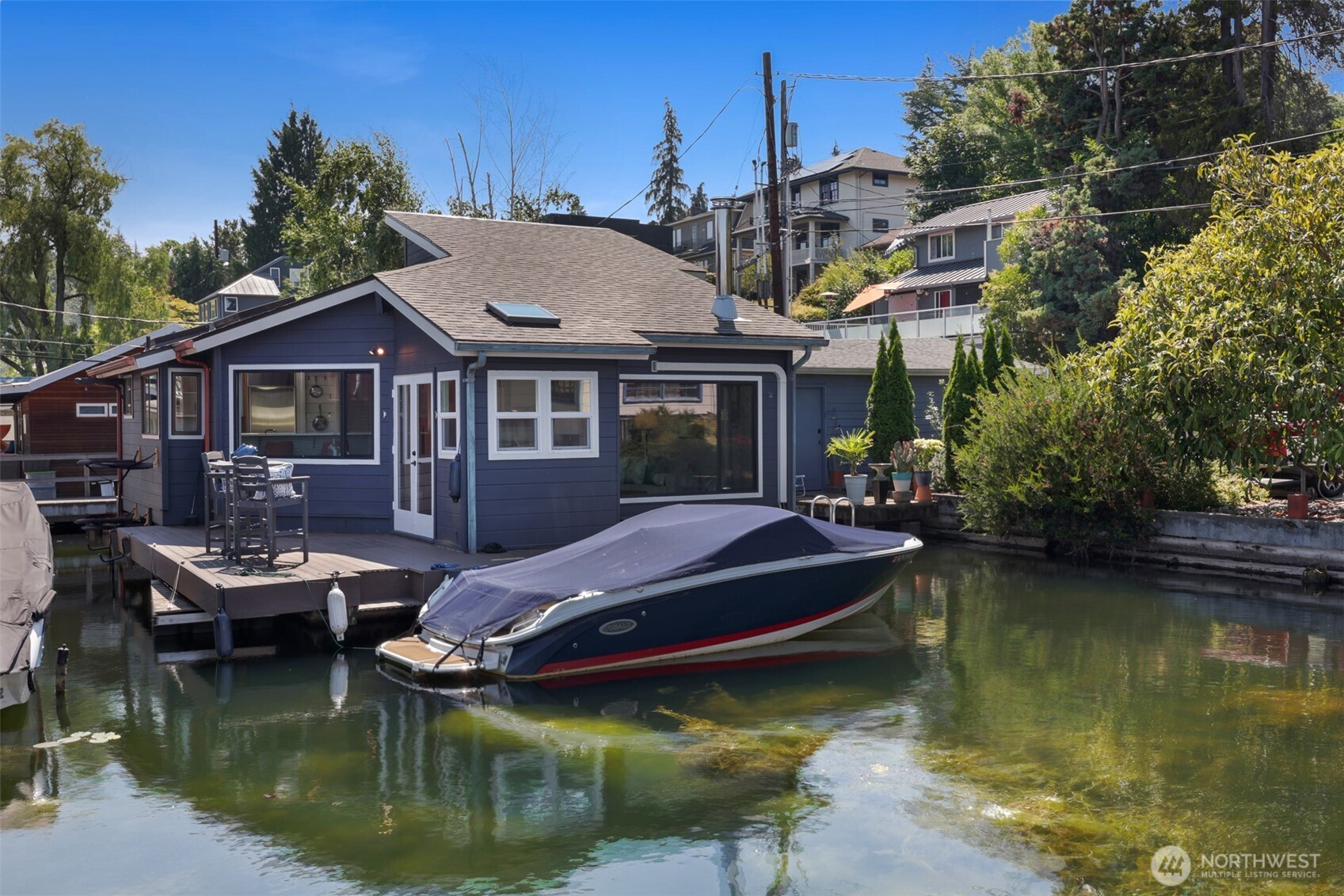Welcome to The Salty Dog; slang for favorite person, best friend... and now favorite floating home. The vibes are undeniably Pacific Northwest for this 1974 year built home. Qualities like the tongue and groove cedar, vaulted ceilings, picturesque windows capturing the natural scene of living on the water and complete serenity.  Massive upgrades include a new roof, windows, decking, new exterior and interior paint, Bosch dishwasher, bathroom vanity, sewer line, carpets, air conditioning, new gangway, Level Lock front door,  and re-stained hardwoods.  Tie up your boat, toss the ball for the dog in the lake, grill some food, and relax.  Portage Bay is very versatile, tucked between I-5 and 520 for easy commuting north/south to downtown Seattle or east to Bellevue or Kirkland.  Park your vehicle in the dedicated parking space and stay awhile.  Moore your boat, and stay awhile.  This one is the full package. This is your The Salty Dog.