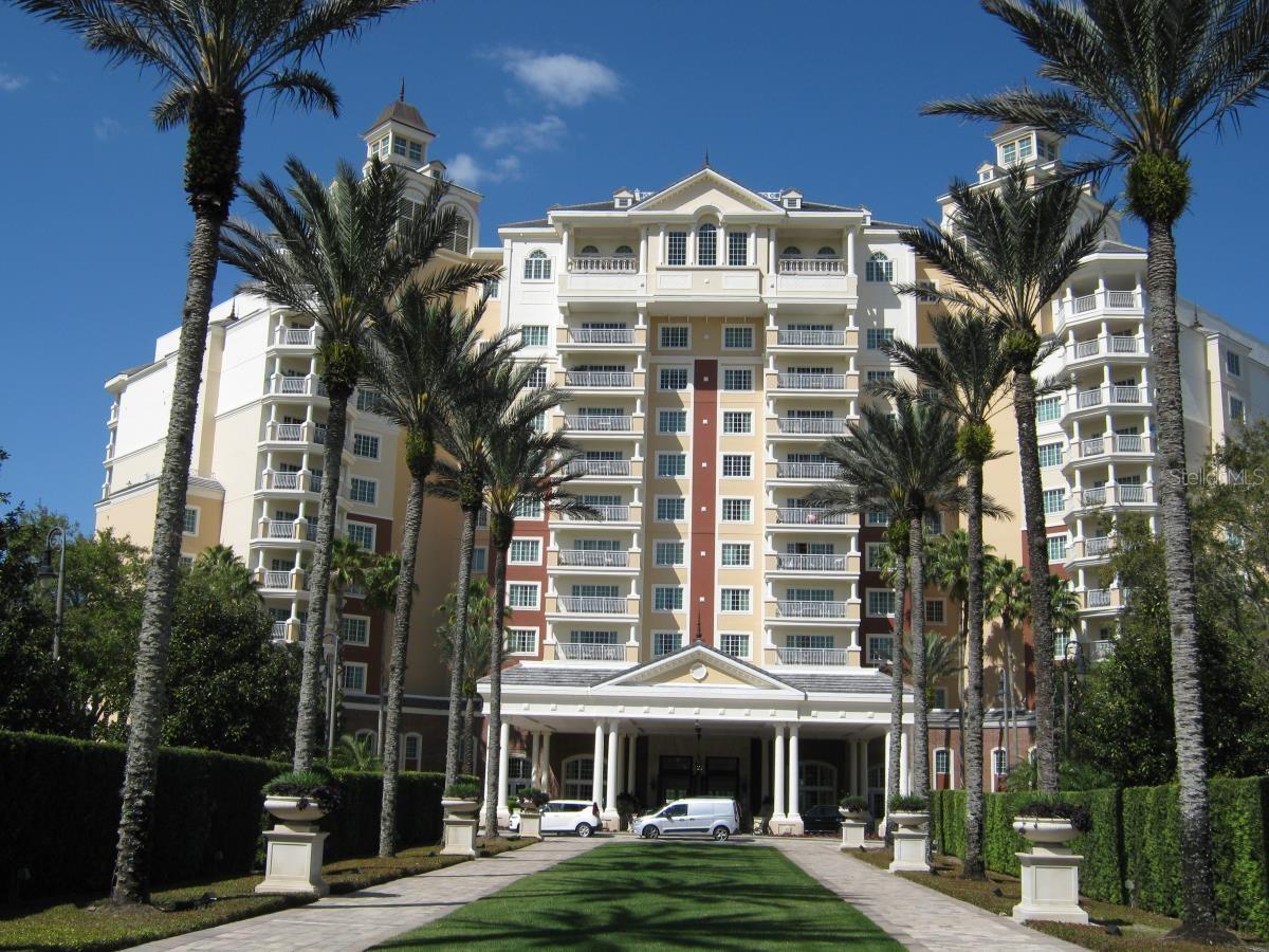 Elegant two-bedroom, two-bathroom residence in the Reunion Grande, the flagship tower of Reunion Resort. Located on the seventh floor with a desirable east-facing exposure, this home provides bright morning light, cooler afternoons, and elevated views over the resort golf courses and driving range.The 1,430 square foot open floor plan features upgraded finishes throughout, ceramic tile and luxury vinyl flooring, and a well-appointed kitchen with modern appliances and granite countertops that flow into the living and dining areas. A split bedroom layout provides two full master suites, each with walk-in closets, dual vanities, garden tubs, and tiled walk-in showers. Crown molding and tasteful decor accent the entire residence.This home is sold fully furnished and turnkey with recently updated furnishings and fixtures. Zoned for rental use in Osceola County, this property is income-ready from day one in one of Central Florida's strongest rental corridors, located just two exits from Walt Disney World and minutes to Universal Studios, SeaWorld, and Orlando International Airport.An active Reunion Resort membership is included and transferable to the new owner, granting full access to three championship golf courses designed by Arnold Palmer, Tom Watson, and Jack Nicklaus, a multimillion-dollar water park with lazy river and slides, twelve resort pools, a full-service spa, tennis and pickleball courts, fitness centers, and multiple on-site dining venues.The Reunion Grande features complimentary valet parking for members, a front desk concierge, a lobby-level sushi bar, the 7593 Chophouse steakhouse, a rooftop restaurant and pool with panoramic views, a gift shop with Starbucks coffee, and elevator access throughout all eleven floors. A complimentary Disney shuttle departs from the Grande front drive for members. Built in 2007. A rare opportunity to own in the most iconic building in Reunion Resort.
