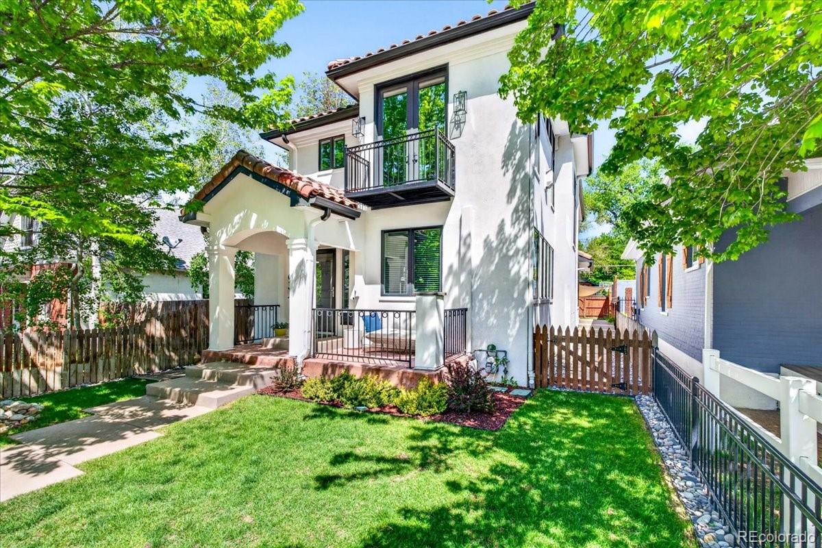 Welcome to this stunning Platt Park gem, where timeless architectural character meets modern upgrades throughout.From the moment you arrive, the Spanish tile roof, stucco siding, and classic archways and niches signal the craftsmanship that defines this home. Inside, the main floor flows beautifully with a light-filled living room anchored by a gas fireplace, a dedicated office just off the living area, and a chef's kitchen featuring quartz countertops, a 6-burner gas range, full Bosch appliance suite, walk-in pantry, and sleek stainless finishes all included with the sale.Upstairs, the spacious primary suite is a true retreat, offering a private balcony, gas fireplace, large walk-in closet, and built-in storage. The luxurious five-piece ensuite bath features double sinks and was beautifully renovated in 2022 with gorgeous new tile. Two additional upstairs bedrooms are served by their own renovated bath, and all three bedrooms benefit from energy-efficient mini-split systems for personalized comfort year-round.The finished basement adds exceptional flexibility with a fourth bedroom, a walk-in shower bath, and custom built-ins, ideal for guests, a home gym, or a second office.Major systems and efficiency upgrades abound: owned solar conveys with the sale, a tankless water heater, Nest thermostat, radon mitigation system, and a furnace and A/C both serviced in 2026 provide peace of mind for years to come.Outside, enjoy a fully fenced yard with a sun sail shade perfect for Colorado summers, plus a 2-car detached garage. All of this with no HOA in one of Denver's most beloved neighborhoods — seconds from Platt Park's shops, restaurants, and parks.