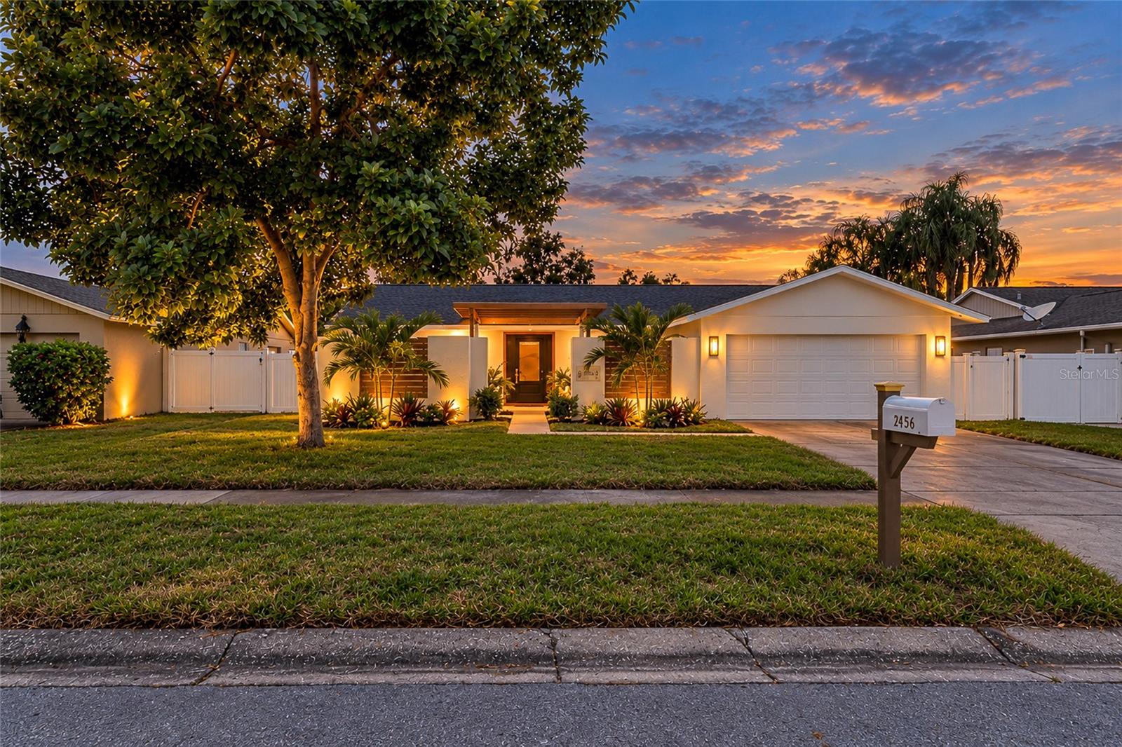 Luxury Living Meets Everyday Comfort in This Exquisitely Remodeled Clearwater Gem!  Experience the perfect blend of elegance and functionality in this fully reimagined 4-bedroom, 2-bathroom residence. From the brand-new roof (2026) and energy-efficient windows to the charming courtyard, every inch of this stunning home has been meticulously renovated with quality craftsmanship and timeless style. Offering a bright, open-concept floor plan designed for modern living and entertaining, this exceptional residence combines luxury, comfort, and convenience.  The heart of the home is a gourmet kitchen showcasing stunning Quartzite countertops, high-end finishes, abundant cabinetry, new appliances, and generous prep space, all flowing seamlessly into the oversized living and stylish dining areas. Luxury engineered hardwood floors flow throughout the home, enhancing the seamless design. The spacious primary suite serves as a relaxing retreat featuring a well-appointed ensuite bath and abundant natural light.  Enjoy four generously sized bedrooms offering plenty of room for family, guests, and a home office. Outside, a 6-foot privacy-fenced yard, new irrigation system, and fresh sod create the perfect setting for relaxation and entertaining. An oversized two-car garage offers exceptional storage and flexibility.  Nestled in one of Clearwater's most desirable areas, known for its friendly atmosphere and welcoming neighbors, this home offers convenient access to shopping, dining, world-famous Clearwater Beach, parks, Tampa International Airport, and major commuting routes. Every detail has been carefully updated, creating a truly move-in-ready opportunity.  Completely turnkey and exceptionally appointed, this is a rare opportunity to own a beautifully updated home in one of Clearwater's most desirable locations. Combining modern upgrades, quality craftsmanship, and everyday comfort, this move-in-ready residence is ready to welcome its next owner. Schedule your showing today!