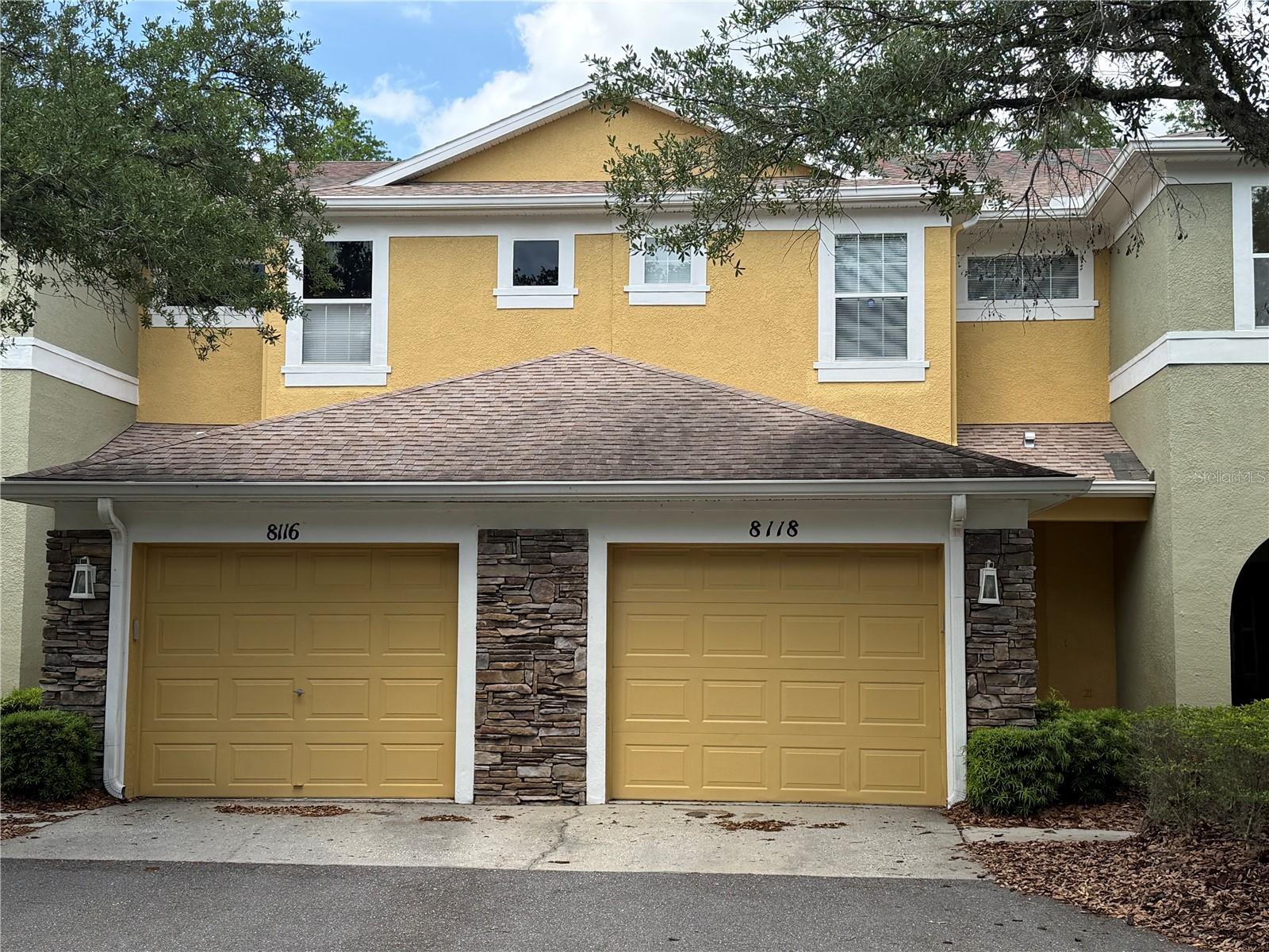Great opportunity to live in a quaint Townhouse community while enjoying resort-style living with endless amenities. This home is located in New Tampa's Stone Ridge at Highwoods Preserve, a gated subdivision within the West Meadows community! Nicely upgraded with quartz countertops, stainless steel appliances, tasteful laminate flooring throughout the living area and in the bedrooms, and a fully screened-in lanai on a conservation lot! The first floor has the living area as well as a full-capacity washer and dryer that convey with the sale. Upstairs, you'll find the bedrooms and a "small loft" area that would work great for a workstation! The home also comes with a 1 car attached garage. Stepping outside, you'll enjoy a beautiful view of the pond: a pond view in the front and a conservation view in the back. The HOA covers the roof (last replaced in 2016), exterior paint, and maintenance-free living so that you can enjoy the West Meadows clubhouse! The community clubhouse features endless amenities: a large heated Jr. Olympic size lap pool, regular pool with a slide, kiddie splash zone, 2 fitness rooms, basketball courts, pickleball courts, a volleyball court, tennis courts, a baseball field, 2 playgrounds, an enclosed "small" and "big" dog park, and walking/bike trails. Zoned for "A" rated Clark Elementary (within the community). Centrally located just minutes from I-75, shopping, restaurants, Wiregrass Mall / Tampa Premium Outlets, & Advent Health Hospital, and so much more!