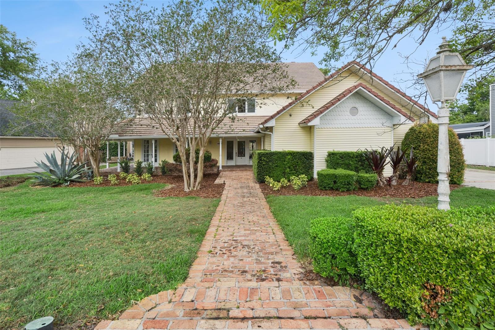 HARD TO FIND SKI LAKEFRONT!  Classic traditional beauty – ready for a lucky buyer to make home. Stunning water & sunset views over Lake of the Woods from most living areas. Enter into the impressive foyer with curved stairway; light & bright large formal rooms with French doors to wrap around covered porch; Large open kitchen, wood cabinets, granite tops, stainless appliances and breakfast nook to sip coffee and bird watch! Inviting family room with fireplace and custom built in surrounds. First level guest suite and full bath; elevator serves to 2nd level huge Master suite, with open deck and lake views; Master bath, dual vanities, Jacuzzi tub and shower, walk in closet. 2 additional large sunny bedrooms share Jack & Jill bath, 3rd upstairs bedroom is ensuite with a large walk in closet. Lovely landscape provides privacy and beauty. New boathouse and dock are ready for action! Super side entry 3 car garage, storage, huge utility room. Survey, pool plan available. Seminole County Schools PLUS excellent Private Schools within a few miles. Neutral colors, tile roof. Bring your water skis, knee boards, fishing poles & kayaks!  Sold As-is; seller may consider decor credit with acceptable offer!