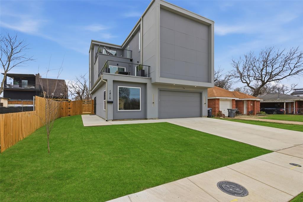 Welcome to 1810 Kraft Street! This truly one of a kind modern contemporary style home is nestled in Trinity Groves and just minutes away from American Airlines Center, Bishop Arts, and the Design District. Step inside to a spacious living or game-room with sliding doors opening to the backyard. Laminate flooring throughout the whole home! 2 secondary bedrooms and a bathroom are also on the first floor. The second floor is the heart of the home which boasts a stunning kitchen with 14-foot granite waterfall island, equipped with state-of-the-art appliances, including electric range and oven, this kitchen is a chef's dream. Ample cabinetry and pantry space to ensure all your storage needs are met. The kitchen seamlessly connects to a bright living room with 18-foot ceilings and numerous windows, flooding the space with natural light, luxury lighting and a 70 inch fireplace. A charming balcony with downtown views extends off the living room, and provides access to the 2nd floor guest bedroom. This floor also includes a well appointed full bathroom and a convenient laundry room. The primary retreat is on the 3rd level and is spacious and bright. It includes a cozy seating area for relaxation which could also be used as an office space, and opens to the balcony where you can enjoy even more great views of downtown! The luxurious ensuite bathroom has dual vanities, a modern free standing soaking tub, and a 2 sided shower offering a spa-like feel. The master also has separate walk-in closets. This home is thoughtfully designed to accommodate a rooftop deck, providing an incredible opportunity for outdoor living and entertaining! A new full water filtration system has also is installed on the home!