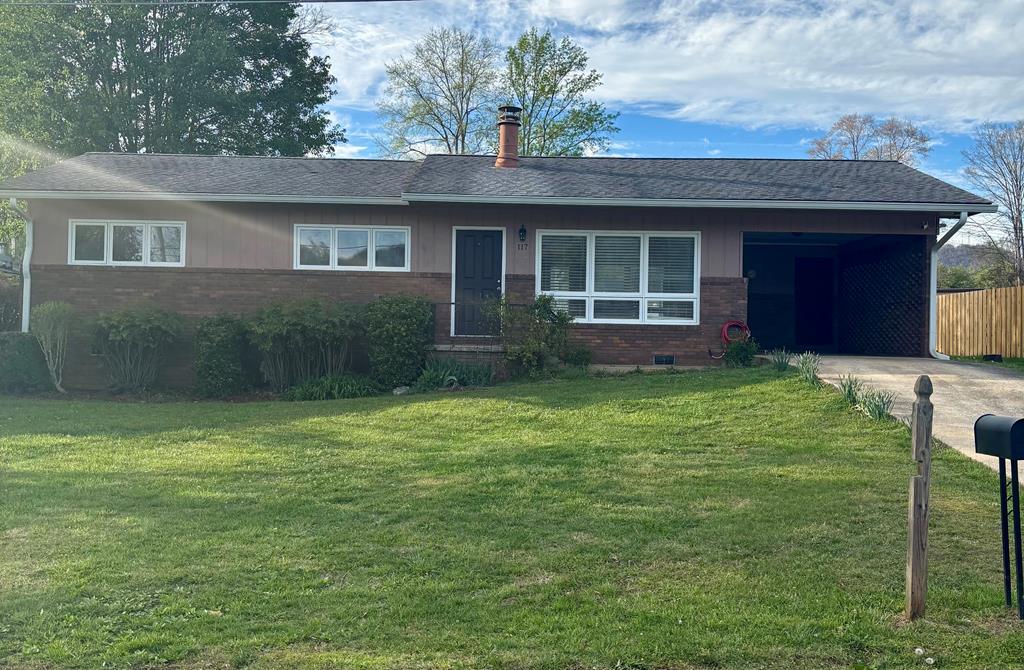 Enjoy the best of in-town living in Murphy.  This charming 3 bedroom 1.5 bath home is ideally located with walking distance to elementary, middle, and high schools, as well as local restaurants, shopping, parks, pool, and fitness facilities.  Inside you'll find an updated kitchen, a cozy gas log fireplace and fiber internet.  The level partially fenced yard offers great space for pets, play, and gardening, while the double detached garage with attached carport provides plenty of parking and storage. A wonderful opportunity to enjoy comfort, convenience, and small town charm all in one.