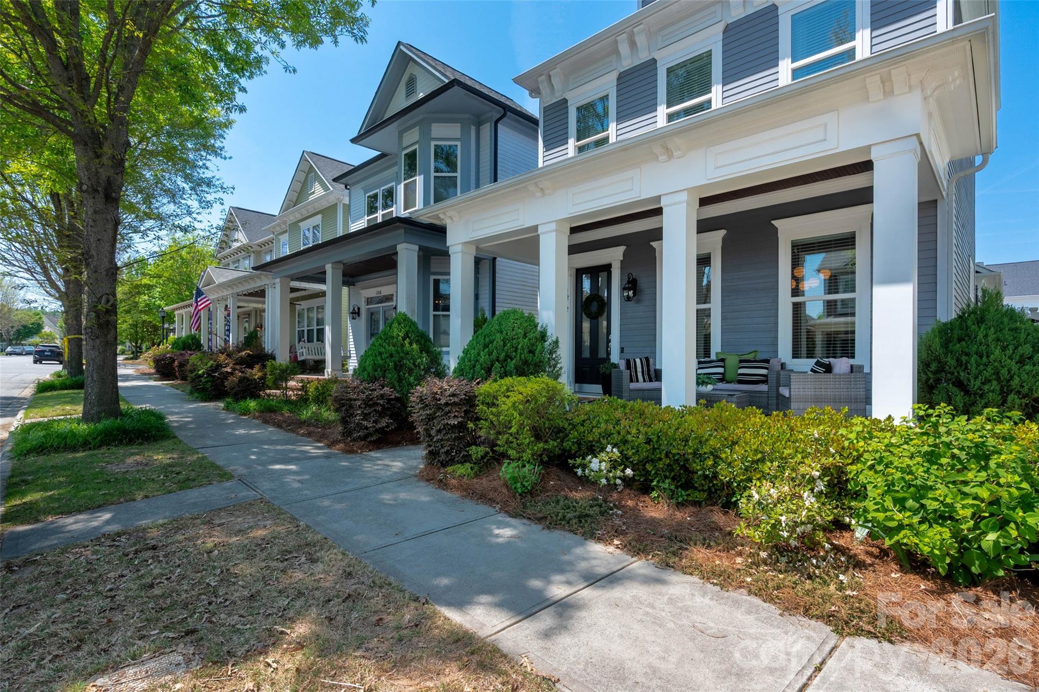 Welcome to Antiquity—where charm, walkability, and lifestyle come together in one of Cornelius’ most sought-after communities. Sidewalk-lined streets connect residents to neighborhood parks, scenic greenways, and all the best of nearby Downtown Cornelius and Davidson, where you’ll enjoy restaurants, coffee shops, boutiques, arts, and everyday convenience just minutes away. This beautifully crafted Charleston-style home, built by Cunane Homes, welcomes you with an inviting front porch—perfect for unwinding at the end of the day. Step inside to an open and airy floor plan freshly painted throughout, featuring crisp white kitchen cabinetry and timeless finishes.The kitchen is truly the heart of the home, complete with a large center island, granite countertops, gas cooktop, stainless steel appliances, and freshly painted white cabinetry. It flows seamlessly into the dining area and spacious living room, where a cozy gas fireplace creates the perfect gathering space. Just off the kitchen, enjoy a private porch ideal for your morning coffee or evening relaxation. A standout feature of this home is the rare main-level primary suite, offering the convenience of first-floor living. This spacious retreat provides comfort and privacy, complete with a generous walk-in closet and an en-suite bath designed for everyday ease. Whether starting your day or winding down in the evening, this private space offers the perfect place to relax and recharge.Nearby, the laundry room connects to the rear-entry two-car garage, equipped with an electric vehicle charger for added convenience. Upstairs, you’ll find generously sized secondary bedrooms connected by a Jack-and-Jill bath, along with an expansive walk-in storage area—providing exceptional storage throughout the home.Residents of Antiquity enjoy the amenities including a swimming pool, dog park, and walking trails. Don’t miss this rare opportunity to own a stunning home in one of Cornelius’ most desirable communities.