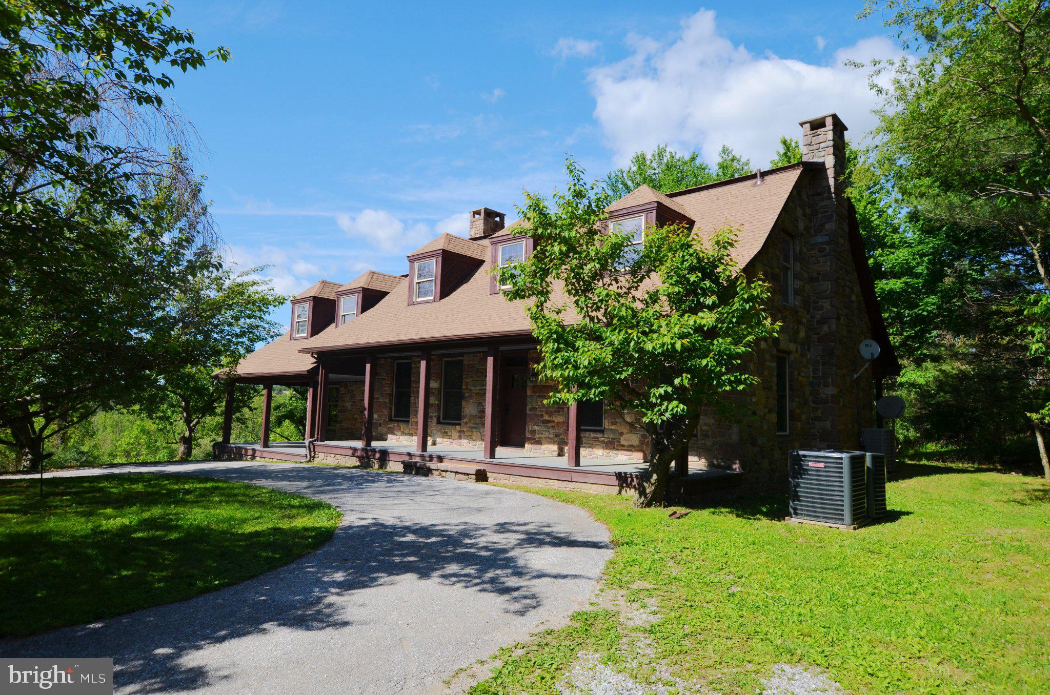 This recently updated Colonial home offers traditional design elements and comfortable living spaces. The property features classic architectural details that define this popular style.This four-bedroom, three-bathroom residence sits on a sprawling 28-acre wooded private lot, offering exceptional seclusion and natural beauty. The home features new granite countertops and stainless steel appliances, new cabinets, creating an elegant and modern environment while maintaining the 19th century elements that were utilized in the home's original design.   Recent upgrades include a new roof, interior/exterior paint, all new HVAC, carpet, and climate controlled crawl space. The welcoming covered front porch leads to a spacious foyer with soaring eight-foot ceilings.  Convenience is enhanced by the second-floor laundry room, while the covered rear porch provides additional outdoor relaxation space.The property is in close proximity to Codorus State Park, perfect for outdoor enthusiasts seeking recreational opportunities. The extensive acreage provides endless possibilities for privacy, recreation, or future additions while maintaining the tranquil, wooded setting that makes this property truly special.  Home is currently enrolled in the Clean and Green program for tax savings. Schedule your private showing today to experience this unique Colonial home's timeless appeal and discover why it could be the perfect place to call home.This is a Fannie Mae HomePath property.