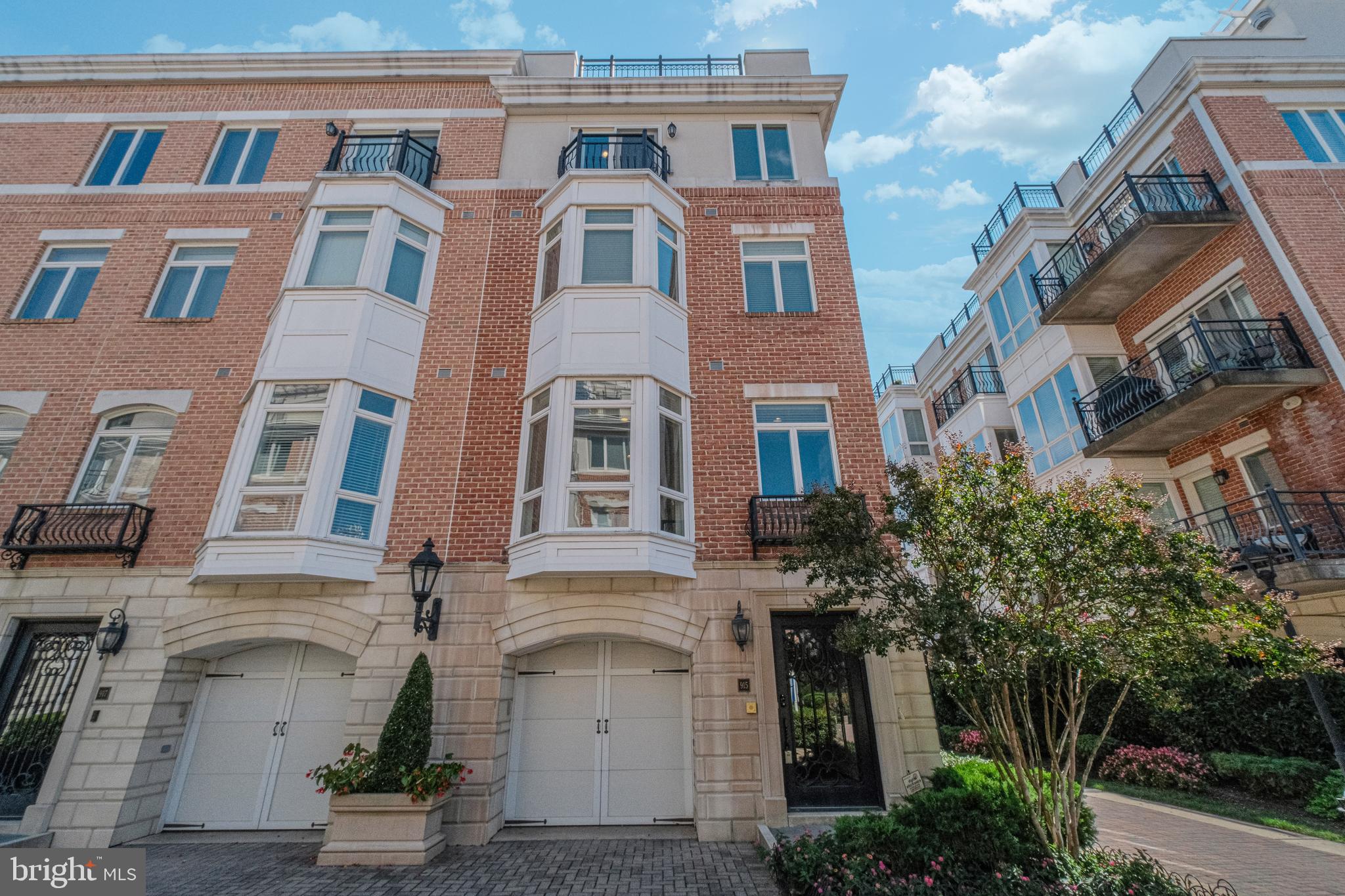 Welcome to one of Baltimore’s premier waterfront communities, where breathtaking water views and resort-style amenities create a lifestyle unlike any other.From the moment you arrive, a striking steel-and-glass entry door sets the tone. Step inside and ascend through five levels of luxury, each connected by your private glass-enclosed elevator. Warm wood floors and elegant iron balusters carry you from one thoughtfully designed space to the next.The journey begins on the entry level with a flexible room bathed in natural light—perfect as a guest suite, home office, or playroom—along with garage access and ample storage.Upstairs, the main living area opens up with sun-filled windows framing waterfront views. A cozy gas fireplace anchors the living room, flowing seamlessly into the dining area and gourmet kitchen. Here, custom cabinets with glass-front uppers, stainless steel appliances, granite countertops, and a massive island with gas cooktop and raised breakfast bar make this a chef’s dream and entertainer’s delight.The entire third floor is your private retreat. Wake up to sparkling water views in the primary suite, complete with dual closets and a spa-inspired ensuite featuring a jetted soaking tub, double vanity, oversized walk-in closet, and a steam shower with eight shower heads. Laundry is just steps away, adding everyday convenience.The fourth floor offers two more spacious bedrooms. One opens to a charming balcony through French doors, while the other boasts a wet bar with mini fridge and its own balcony overlooking the harbor. A full bath with soaking tub completes this level.At the top, the fifth-floor rooftop terrace is the crown jewel—an entertainer’s paradise with panoramic water and city views, an expansive lounge space, and a wet bar with mini fridge. From here, you can watch fireworks and sunsets that turn every evening into an event.Living at Pier Homes at Harborview means more than just a home—it’s a lifestyle. Resort-style amenities include 24/7 security with on-demand escorts, guest parking, a private fitness center, outdoor pool, beautifully landscaped grounds, private marina, and convenient snow and trash removal. All this, just steps from Baltimore’s best dining and entertainment. Welcome Home!