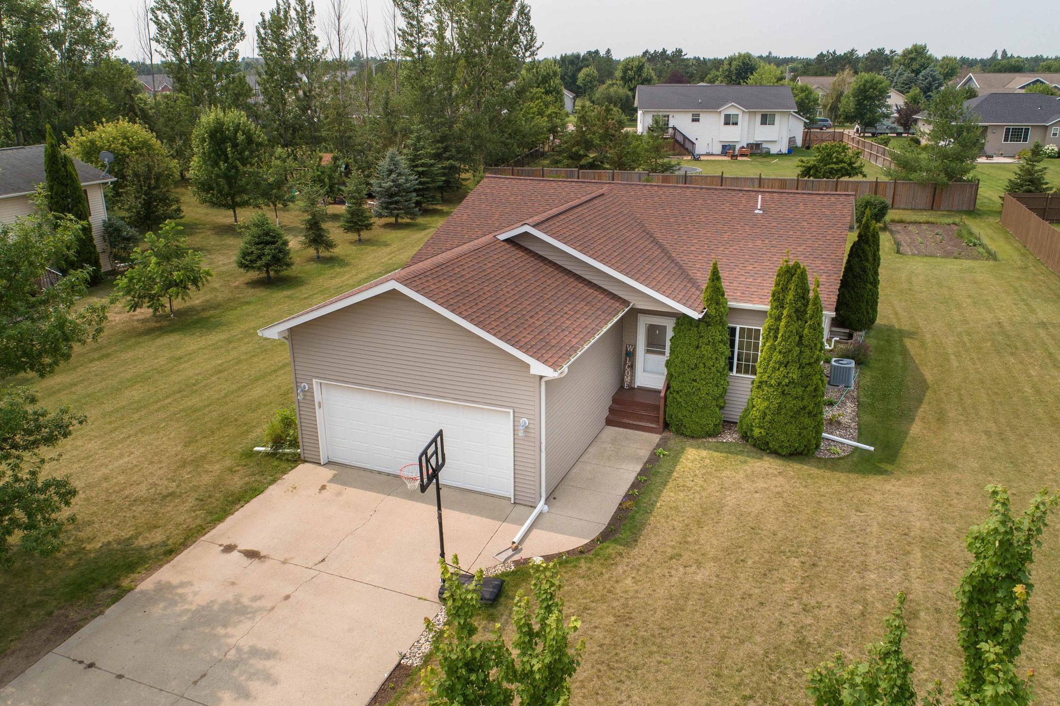 This spacious 5-bedroom, 2-bath home is ideally situated close to amenities like the golf course, walking/bike paths, and parks, which is perfect for recreation and relaxation.  The main level features 3 bedrooms and a full bath, offering convenient living arrangements. Downstairs, there are 2 additional bedrooms and a 3/4 bath, providing flexibility for offices and guest rooms.  With both a main level living room and a lower level family room, there's plenty of space for both relaxation and entertainment. The nine-foot ceilings and wide hallways enhance the spacious feel throughout the home.  The back deck offers opportunities for outdoor enjoyment, whether it's for dining, socializing, or simply enjoying the fresh air. The large yard complements this with room for activities, gardening, and landscaping.  The low maintenance vinyl siding ensures the home remains aesthetically pleasing with minimal upkeep required.  With a 2-stall attached garage, there's ample space for parking and storage, adding to the practicality of daily living.  Overall, this home offers a balance between comfort, practicality, and convenience, making it a desirable option for a well-rounded living environment.  Check it out today!