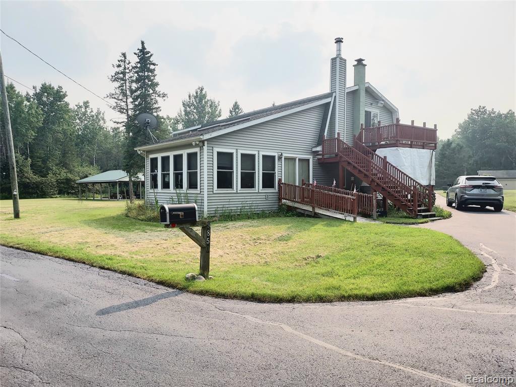 HIDDEN PARADISE IN THE WOODS OF NORTHERN MICHIGAN. COME ENJOY THE SERENITY OF MOTHER NATURE WHETHER IT'S GARDENING, WILDLIFE WATCHING, HUNTING OR SWIMMING IN A BEAUTIFUL SPRING FED POND. VERY NICE FIVE BEDROOM HOME. GOOD SIZE PRIMARY BEDROOM ON FIRST FLOOR WHICH INCLUDES A VERY SPACIOUS WALK IN CLOSET AND PRIVATE DOORWALL LEADING TO A PATIO AREA. AN ADDITIONAL ROOM/LAUNDRY ROOM ALSO ON FIRST FLOOR. HUGE BEDROOM ROOM UPSTAIRS WITH DOORWALL LEADING TO AN OUTSIDE DECK. TWO ADDITIONAL BEDROOMS UPSTAIRS. EACH FLOOR HAS A FULL BATH. THE FIRST FLOOR BATHROOM INCLUDES A CUSTOM BATHTUB/SHOWER WITH EASY ACCESS. ENJOY THOSE COOL NIGHTS AND WINTERS WITH THE STONE FIREPLACE. HOME HAS A FULL HOUSE GENERAC GENERATOR FOR ANY KIND OF POWER INTERRUPTION. LARGE LIVING ROOM AND FAMILY ROOM. NEWER PLANK FLOORING IN LIVING ROOM, FAMILY ROOM AND KITCHEN. PLENTY OF CABINET SPACE AND STORAGE IN KITCHEN. KITCHEN ALSO HAS UPGRADED CABINETS. SPACIOUS MUDROOM FOR STORAGE OF FIREWOOD IN THE WINTER TIME AND INCLUDES AN ADDITIONAL REFRIGERATOR. MUDROOM HAS ITS OWN HEATING. OUTSIDE INCLUDES A DUAL ENTRY DRIVEWAY. DRIVEWAY ALSO EXTENDS ALL THE WAY DOWN TO A LARGE POLE BARN. POLE BARN HAS ELECTRICITY AND PLENTY OF SPACE FOR VEHICLES, OFF ROAD TOYS, STORAGE, ETC. A LARGE PAVILION IS OFF THE SIDE OF THE HOME AND IS GREAT FOR ENTERTAINING OR JUST RELAXING IN WHILE ENJOYING YOUR SURROUNDINGS. WHOLE DRIVEWAY JUST SEAL COATED JULY 2025. LAND CONTRACT TERMS AVAILABLE: $100,000 DOWN, $1500 MONTHLY PAYMENT, 8% INTEREST RATE AND A FIVE YEAR TERM. SALE INCLUDES PROPERTY ID NUMBERS: 05200500080100 AND 05200800004100.