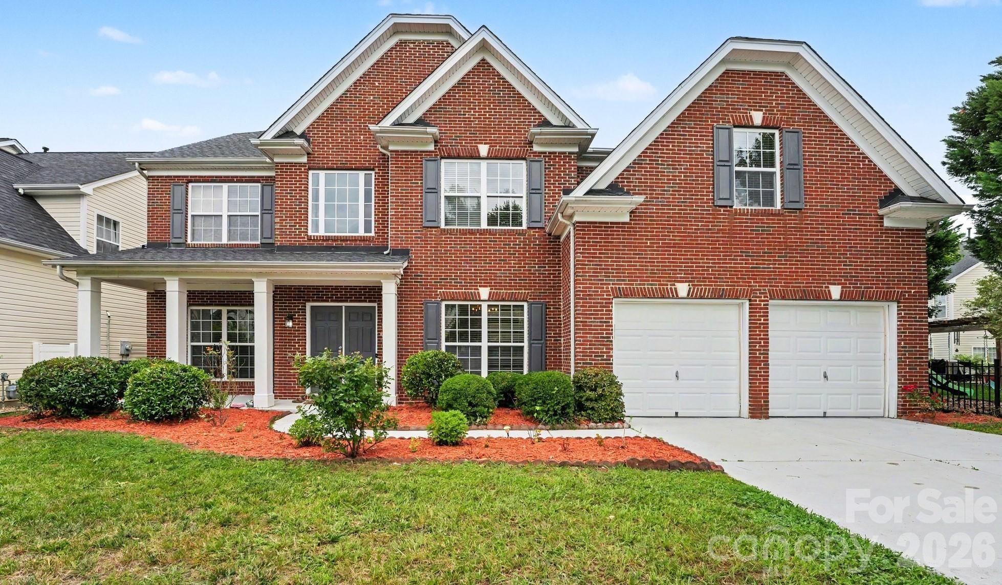 Welcome to this spacious and beautifully maintained 6-bedroom, 4-bathroom home in one of Concord's most desirable communities and within the highly sought-after Cox Mill School District. Offering a flexible floor plan designed for today's lifestyle, this home provides the perfect blend of comfort, functionality, and outdoor living.The main level features a convenient guest bedroom and full bath, ideal for visitors, multi-generational living, or a private home office. At the heart of the home, you'll find an expansive kitchen with abundant cabinetry, generous counter space, and an open-concept design that seamlessly connects to the living and dining areas—perfect for entertaining family and friends.Upstairs, retreat to the oversized primary suite complete with a spacious bedroom, en-suite bath, and large walk-in closet. Three additional secondary bedrooms provide plenty of space for family and guests, while the huge bonus room offers endless possibilities as a sixth bedroom, media room, playroom, home gym, office, or flex space.Enjoy outdoor living from the charming covered front porch or relax on the rear patio overlooking a yard filled with mature fruit trees. The irrigation system, covered by the HOA dues, helps keep the landscape looking its best with ease.