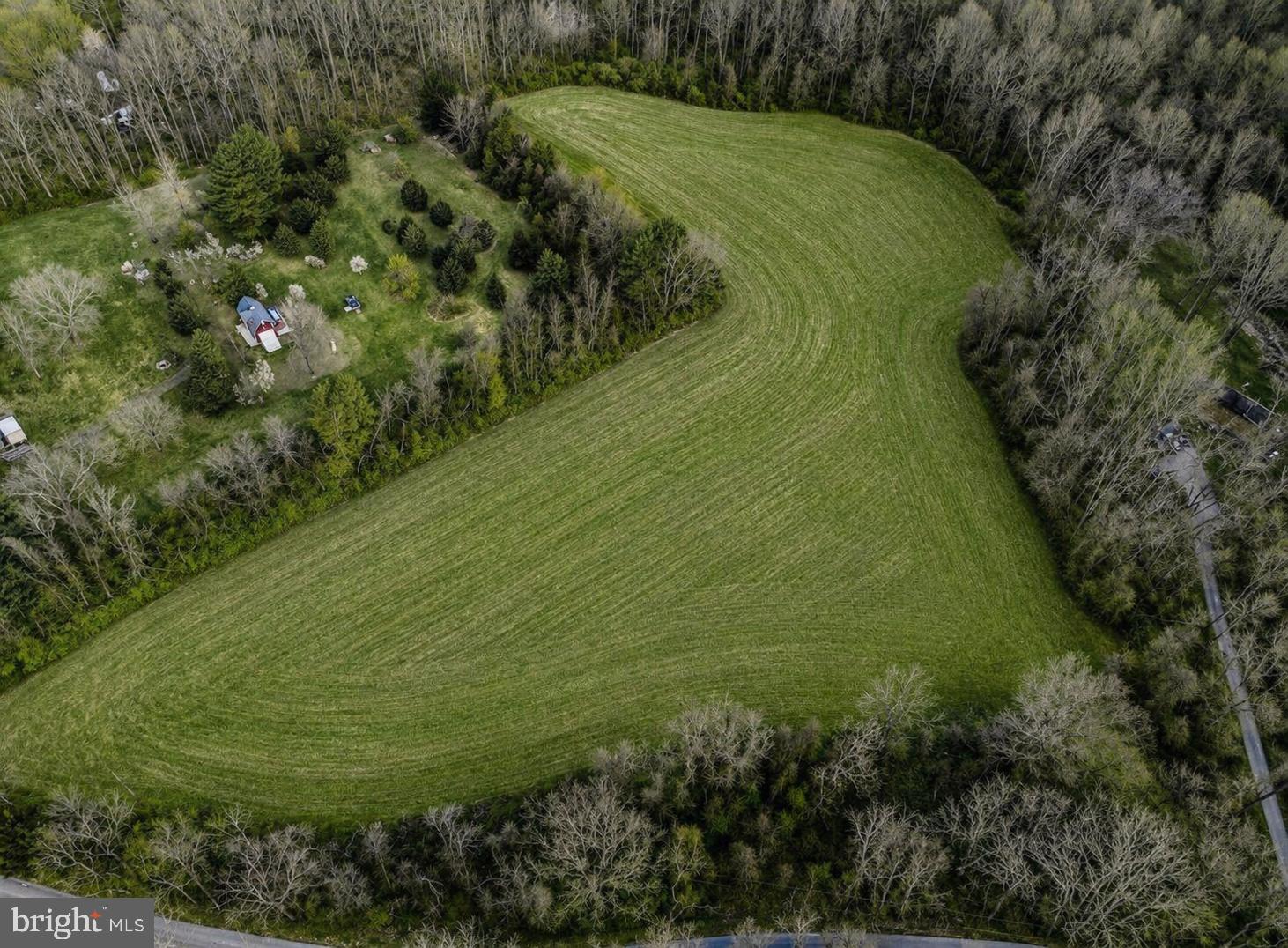 Imagine building your custom dream home on this extraordinary 9.89 acre retreat, where privacy, peace, and breathtaking views come together in a truly inspiring setting. Design a home that captures stunning views from nearly every room, welcoming both spectacular sunrises and unforgettable sunsets into daily life. Despite its secluded feel the NCR Trail is a walkable distance away and Monkton Village, Hereford, Inverness Brewery, Manor Tavern, and Graul's Market are all just minutes away.With no builder tie-in, the freedom is entirely yours. A well installed in 2023 and an approved septic perc are already in place positioned to complement the natural contour of the land and maximize your future home site's views. A licensed engineer’s concept plan shows the possible potential for subdivision* to create a second building lot.  Whether you envision a private estate, a multigenerational opportunity, or simply the freedom to craft something exceptional, this is a property where your vision can truly come to life. A rare chance to craft something exceptional — peaceful, inspired, and beautifully rooted in the landscape you'll call your own.*County approval on subdivision is the buyer’s responsibility. The drawings provided are concepts based on the current zoning codes and are not approved plans. Contact the listing agent for concept plans and well & septic info.
