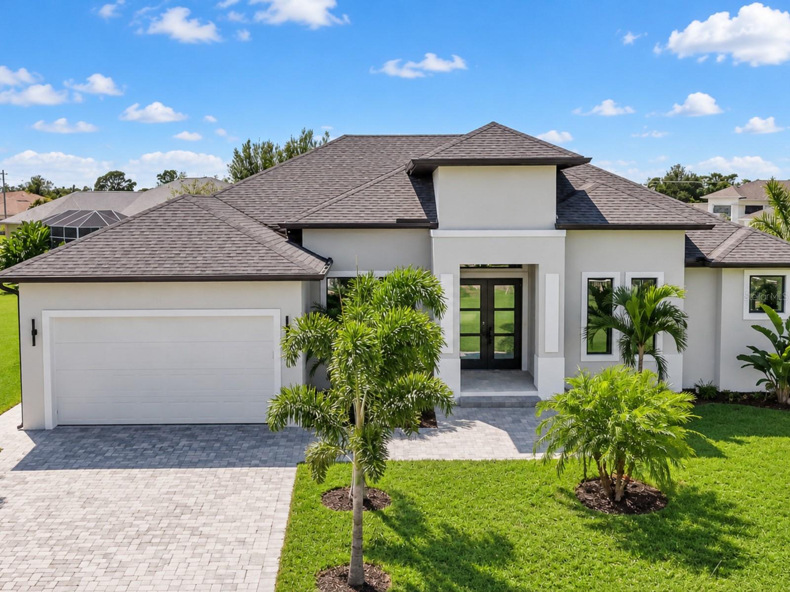 Welcome to this beautiful new-construction home on a spacious half-acre corner lot. This bright and open home offers three bedrooms, an office, two full bathrooms, and one half bathroom.The large kitchen features plenty of cabinet space, a beautiful waterfall island, a dining area, and a breakfast nook. The living room has 11-foot ceilings, an electric fireplace, and large sliding glass doors that fill the home with natural light. Tile flooring runs throughout.The spacious primary suite includes two walk-in closets and a beautiful bathroom with a large glass-enclosed shower. The split floor plan places the other two bedrooms on the opposite side of the home for added privacy.Outside, enjoy the fully screened lanai and private pool, surrounded by mature trees. Tropical landscaping with many palm trees and a paved driveway complete this beautiful property.Schedule your private showing today!