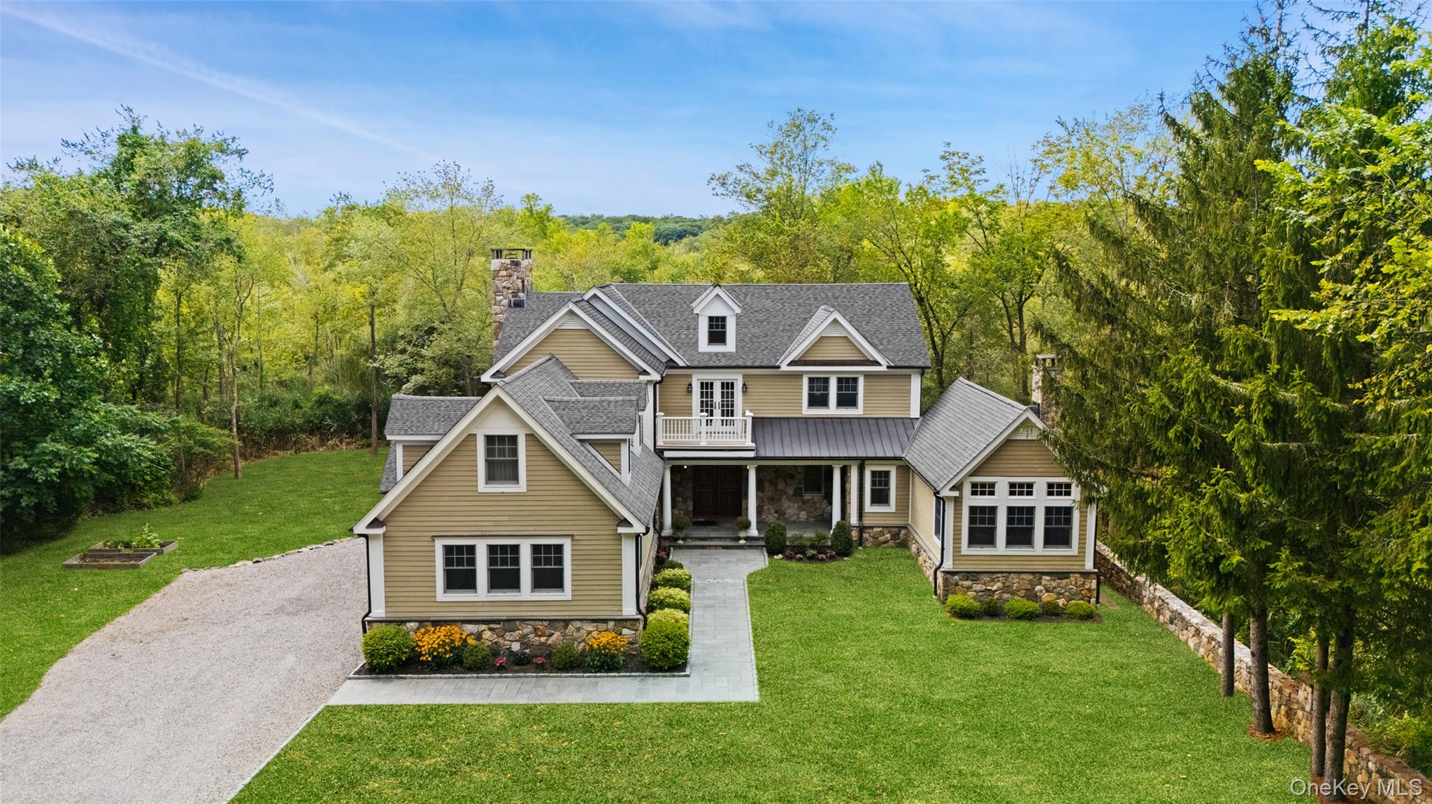 Welcome home to this exquisitely crafted and meticulously maintained colonial, perfectly set on 9 acres of serene natural beauty—offering the comfort, elegance, privacy and charm you’ve been searching for! 

Step through the grand mahogany doors and discover a spacious living room with a fabulous fireplace, an elegant dining room ideal for holiday gatherings, and a stunning French Country kitchen with a massive center island. The kitchen seamlessly opens to a spectacular family room, where a fireplace and coffered ceiling add an extra layer of sophistication to this custom home.

Just off the kitchen, you’ll find both a butler’s pantry and food pantry—perfect for staying organized whether entertaining or enjoying everyday living. Additional conveniences include a powder room, mudroom and a separate laundry room with abundant cabinetry and a utility sink, copper gutters, and a large two car garage with custom mahogany garage doors. 

Up the grand stairway awaits 3 generously sized bedrooms and an additional bonus room, a library, and 3 full bathrooms—designed to accommodate the whole family. This spacious home lives like a 4 bedroom. The primary suite feels like a spa retreat, featuring tray ceilings, French doors leading to a private balcony, two large closets, and a luxurious bath with double vanity, jacuzzi tub, and shower.

Outdoor living is equally impressive, with two large balconies accented with Azek trim and cedar, a romantic Juliet balcony, and a stunning covered side porch. Whether you’re looking to enjoy your morning coffee, enjoying an evening glass of wine, or hosting lavish parties, this property offers all the outdoor space you can dream of. 

Throughout the home, you’ll find abundant windows filling each room with natural light, plus plentiful closets, built-ins, and storage. Award-winning schools, tranquil neighborhood, central air conditioning, and exquisite exterior stonework are just a few of the many additional perks.

This exceptional property truly checks every box. Don’t miss the opportunity to make it your forever home!