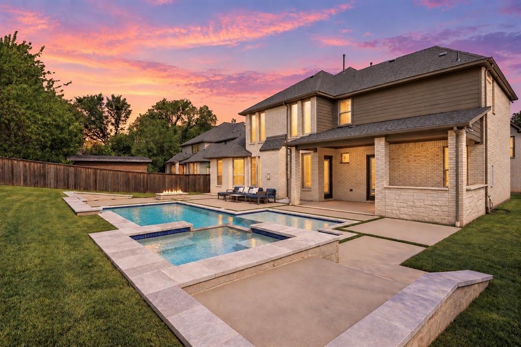 Behind the gates of an exclusive Colleyville community, this luxury home feels like a private retreat, with room to gather, unwind and make the home your own. Set on the neighborhood’s largest lot, this coveted MI Homes Carrera model was built with all exact same high end finish outs as the model home. The seller added one of the largest heated pools in the neighborhood, complete with a spa and beautiful water features. The backyard is far more than a pool: enjoy the added outdoor kitchen with built in grill & drink cooler, the cozy fire pit and expansive lawn, with space for play, gardening or whatever you’ve been dreaming of. A covered side courtyard offers another inviting place to slow down and enjoy home.Inside, soaring ceilings and a thoughtful layout create an impressive welcome with it's 2 story entry. The chef inspired kitchen pairs built-in appliances with a Monogram gas cooktop, while the formal dining room, media room and upstairs game room make entertaining effortless. A massive under stairs storage area offers exceptional room for all the things a home this size can hold.Two primary suites are located downstairs, each with a lovely view of the backyard & pool. The main primary also has a coffee bar area which is currently being used as a small study nook. The remarkably private office is tucked between the 1st and 2nd floors. Upstairs, 3 additional bedrooms provide comfortable guest accommodations: two of them share an en-suite bath, while the other is steps from a full hallway bath, convenient for guests enjoying the media or game room.Picture slow mornings in the courtyard, sun-filled afternoons by the pool and evenings gathered around the fire pit. With separate spaces for movies, games and guests, everyone can find room to connect or unwind. When you’re ready to explore, H-E-B and everyday conveniences are close by, along with a beautiful trail that follows Little Bear Creek. This is a home that makes staying in feel like the best plan.