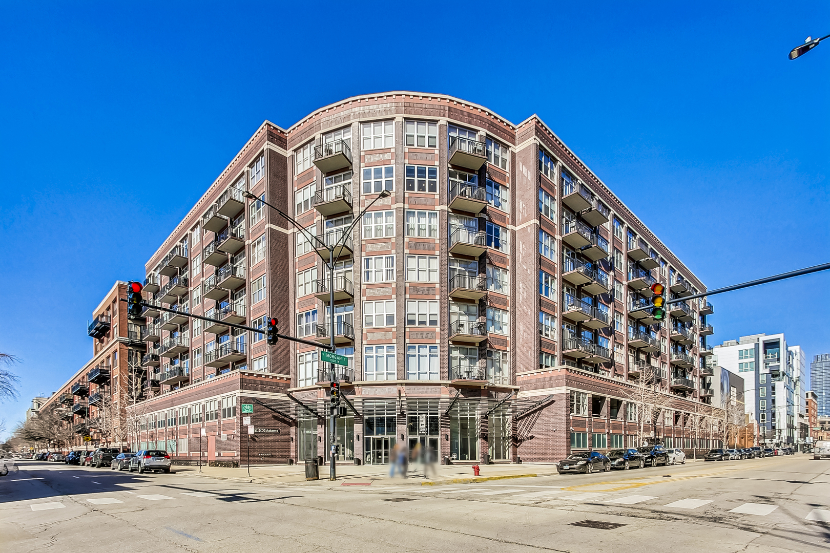 Welcome to 1000 W Adams St #815, a beautifully updated 1-bedroom, 1-bath penthouse-level condo in the heart of Chicago's vibrant West Loop. With nearly 900 sq ft of living space, this top-floor home combines modern updates with city convenience, offering a thoughtful layout and stylish finishes throughout. Enjoy hardwood floors throughout, a renovated bathroom, and a new custom closet system in the spacious bedroom. The open living and dining area flows seamlessly to your own private balcony, showcasing an unobstructed north view-perfect for morning coffee or evening sunsets. For added convenience, the home also includes in-unit laundry. A rare perk of this unit is the grand-sized private storage room, providing an abundance of space rarely found in the city. One garage parking spot is available for an additional $25,000. Located in the highly sought-after 1000 W Adams building, residents enjoy full access to top-tier amenities including a stunning rooftop deck with skyline views, a peaceful courtyard, renovated business center, expansive fitness center, 24-hour door staff, a welcoming lobby, electric car charging station, bike room, full-service dry cleaners, and a solid, well-managed HOA. Perfectly situated on a prime corner lot in the West Loop, this home offers the ideal balance of tranquility and accessibility. Non-metered street parking on Morgan and Adams makes coming and going easy, while being just two blocks from Madison Street keeps you close to the neighborhood's vibrant core. You'll be steps from Mary Bartelme Park, Target, Mariano's, Whole Foods, the potential future home to Trader Joe's and Aldi's, the Morgan (Pink/Green Line) and UIC Halsted (Blue Line) 'L' stops, and the iconic Restaurant Row on Randolph. With quick access to the Loop and expressways, commuting is effortless. This is a rare opportunity to own a fully turnkey, move-in ready home in one of Chicago's most sought-after neighborhoods.