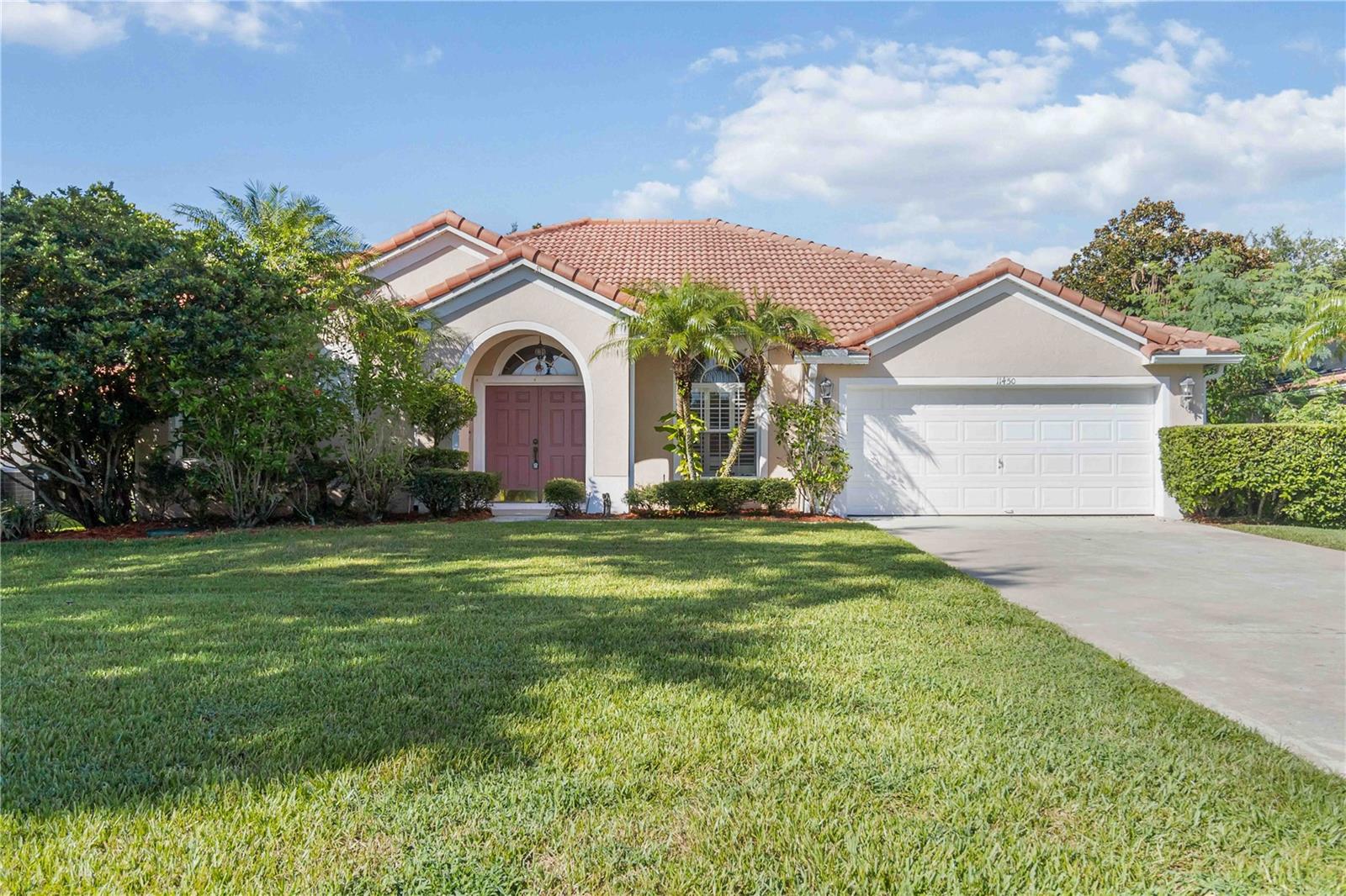 One or more photo(s) has been virtually staged. Welcome to this well-maintained 4-bedroom, 3-bathroom home located in the gated community of Glenmuir. This traditional-layout residence offers a blend of classic elegance and modern comfort. Step inside to discover beautiful hardwood and tile flooring that flows seamlessly throughout the home.

The heart of this home is its inviting living spaces, featuring both formal and casual areas perfect for entertaining and everyday living. The kitchen is a chef's delight, boasting ample cabinet and countertop space, a convenient island, bar seating, and a sunny breakfast nook overlooking the pool area. A flexible bonus room or study at the front of the home can be used as a home office, gym, or playroom.

The private primary suite is a true retreat, offering direct access to the screened-in lanai and pool and an ensuite bathroom features a separate shower, a relaxing garden tub, and a dual vanity. The spacious secondary bedrooms provide comfort and privacy for family and guests.

Step outside to your private oasis, where a screened-in lanai encompasses a sparkling pool and spa, surrounded by a paver patio—the perfect setting for outdoor gatherings and relaxation. The fenced-in green space offers a secure area for play and pets.

This home features a number of upgrades include new HVAC, Water Heater, Water Softener, Washer & Refrigerator, Gutters and fresh paint in the primary and guest bedrooms. Located in a prime Windermere location, this home combines security of a gated community with a great location and easy access to highways, schools, shopping and more. Don't miss the opportunity to make this exquisite property your own.