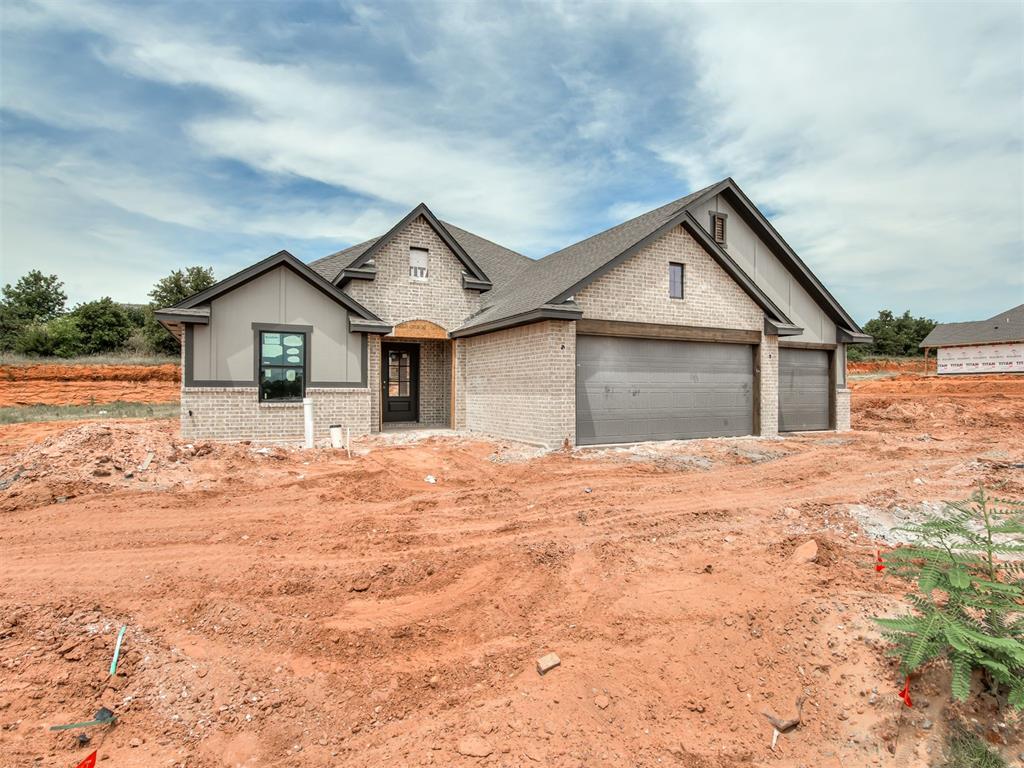 Ask about our incentives! Welcome to this beautiful new construction spec home by The Builder's Collective, located in the desirable community of The Preserve in Edmond, OK. This thoughtfully designed traditional layout offers a spacious living space, featuring three bedrooms, two bathrooms, and a dedicated study. The heart of the home boasts a grand living room with a vaulted ceiling and an electric fireplace, perfectly positioned alongside an open kitchen, dining area, and a functional mud bench & a 3 car garage. Schedule your private tour today!