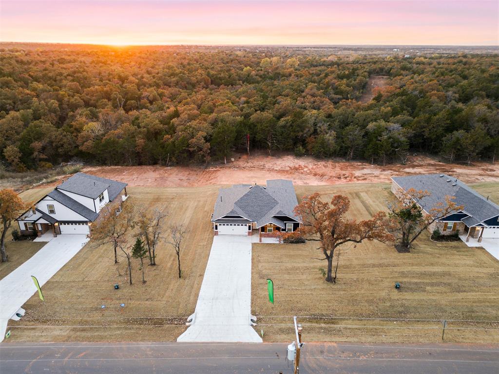 **$5,000 Builder incentive to use towards rate buy-down, closing costs, or upgrades!! **Welcome to Timberwood, Edmond’s newest large-lot community offering the perfect blend of space, style, and convenience! This beautiful Opal floorplan offers 3 spacious bedrooms, 2 full bathrooms and a half bath on more than a half-acre of peaceful, serene land. Bright, sunbathed, airy and open, the spacious kitchen features granite countertops, a center island, stainless fixtures and appliances, plenty of storage and a large pantry. The kitchen opens to a dining and cozy living room, with upgraded wood-look tile and plenty of large windows for spectacular views! The primary suite features a private bath with a large double vanity and a spacious closet, along with three additional bedrooms and another large bathroom. All of this rests on a large lot that not only offers stunning sunrises and sunsets that will take your breath away, but also peaceful, starry nights where you can gather around a fire pit with family and friends and actually be able to see the night sky! The community is SHOP-APPROVED and also qualifies for USDA (zero-down!), and is located in the highly-sought after Edmond Public School District, and conveniently located near plenty of restaurants and shopping, and only minutes from Oklahoma City, Tinker AFB and Stillwater!***PLUS AGAIN $5,000 Builder Incentive towards upgrades, a fence, a storm shelter, or closing costs!! Ask how several families have already been able to purchase their home this year, bringing ZERO to the closing table and getting a check back at closing!!***