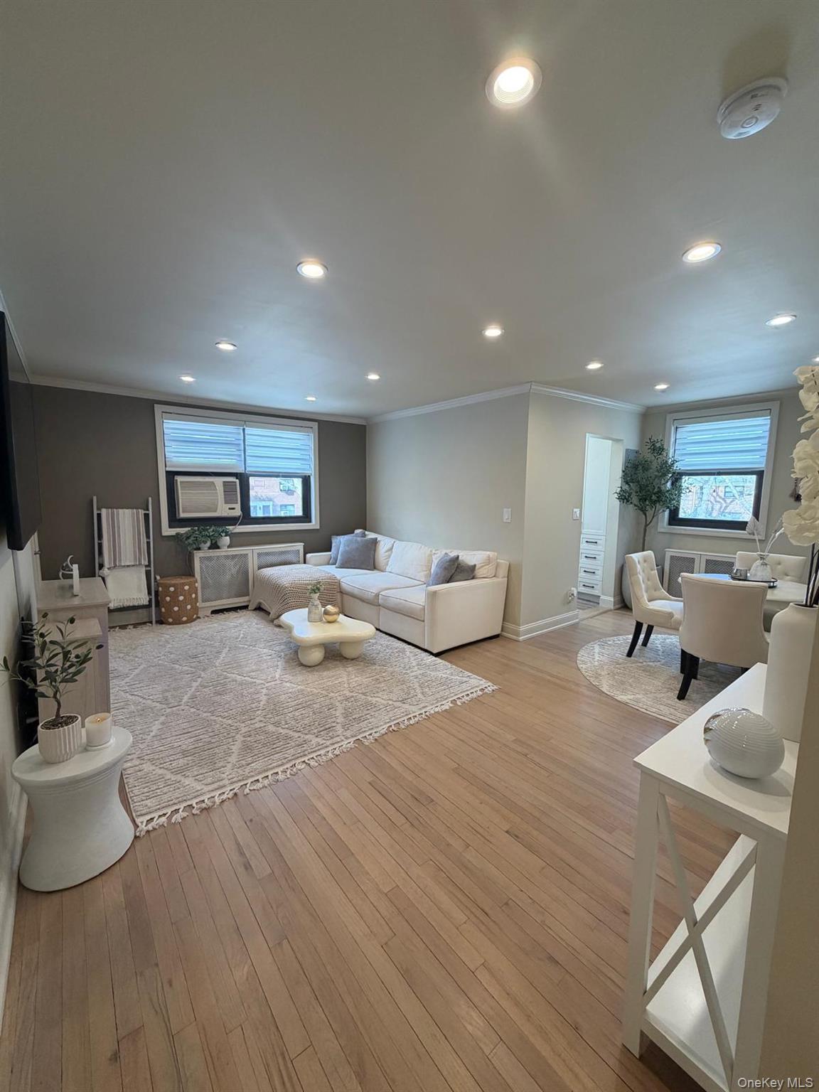 Fully gut-renovated one-bedroom upper co-op featuring a modern open-concept layout with a stunning granite and stainless-steel kitchen, spacious living room, large primary bedroom, and one full bath. The sleek kitchen offers granite countertops, custom cabinetry, stainless steel appliances, and abundant recessed high-hat lighting. Beautifully finished hardwood floors and elegant crown molding run throughout the entire unit, complemented by professional blinds and exceptional lighting. Renovations include updated electrical and plumbing — truly a turnkey home with absolutely nothing to do.Enjoy exceptional storage, including a full attic the size of the unit, plus washer/dryer hookup available in-unit. Cable included.Situated on a quiet, tree-lined block in the heart of Whitestone, nestled within a large, beautifully maintained courtyard setting — tucked away like a hidden gem yet moments from shopping, dining, and transportation. Parking available with garage waitlist.Move right in and enjoy one of Whitestone’s best-kept secrets.