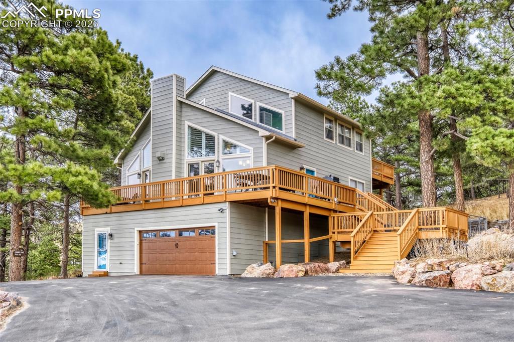 Amazingly maintained home in popular Peyton Pines! On 5+ acres with the feeling of true mountain living with mature ponderosa and gorgeous views of the Bijou Basin and The Bijou Springs Ranch which is thousands of acres of ranch land. This 2660+ sf home is located on a culdesac with nice rolling hills, valley views, and beautiful skies.  Three bedrooms, three full baths, two family rooms, and upper master suite, plus a multi use building currently with two Priefert stalls but easily converted to a shop or hobby building. Tucked away and quiet, a paved driveway leads up to the home sitting atop a hill and overlooking the land.  The home is totally updated with beautiful appointments.  The kitchen features newer cabinetry, solid quartz counters, island, stainless appliances, and walk in pantry.  The open concept great room overlooks a deck and the Bijou with high vaults, Transom windows and a nice dining area all walking out to the wrapped deck.  Completing the main level are two secondary bedrooms and updated main level bath. The upstairs features the primary bedroom retreat with its private back deck and spa like master with tumbled travertine and glass tile.  The basement features a family room and 4th bedroom with its private bath.  The basement also consists of a nice sized laundry room, easy dog area and leads to the oversized two car garage.  Other amenities include ac, plantations shutters, draperies, hand scraped hardwood floors, tiered decking, vinyl and aluminum clad windows, retaining walls, and rock walls. Top quality home with attention to every detail.   The barn/shop is heated plus two turnouts, cross fencing with round posts.  Zoned for horses, covenants but no HOA, 4-H animals ok, rural schools, and commutable to Springs or Denver.  Walking and riding easements throughout the subdivision. A joy to see and show!