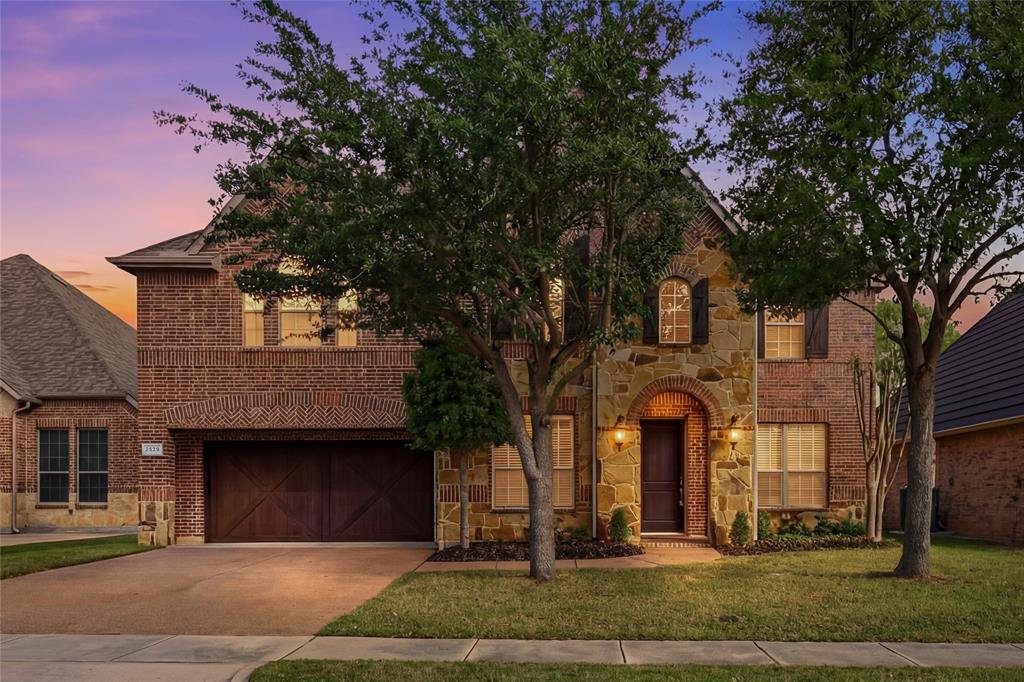 Discover a sophisticated retreat in the heart of coveted Trophy Club with this stunning residence, perfectly positioned within walking distance to top-rated schools, miles of trails, and the community pool and splash pad. A striking brick and stone elevation with classic shutters and a recently replaced roof welcomes you into a light-filled interior where new carpet and fresh paint create an immediate sense of grandeur and airiness. The family room serves as a breathtaking central gathering place, where soaring two-story ceilings and a magnificent floor-to-ceiling stone fireplace create a dramatic yet inviting backdrop for everyday life. Work from home in the executive office featuring a wall of built-ins and French doors, or host friends and family in a kitchen equipped with granite countertops, stainless steel appliances, under-cabinet lighting, and a large island with a breakfast bar. Retreat to the secluded downstairs primary suite to enjoy a tray ceiling, bay windows, and a spa-like bath with a jetted tub, dual-sink granite vanity, separate shower, and a walk-in closet with built-ins. Upstairs, entertainment options are endless with a spacious game room and a fully equipped media room featuring a projector, screen, dimmable lighting, and built-in speakers. Each secondary bedroom offers the luxury of a walk-in closet, complemented by a built-in study center for organized living. Practicality meets style with a deluxe laundry room showcasing built-in cabinets and a sink, plus a separate mud room leading to an oversized garage with epoxy flooring perfect for extra-large vehicles. Your backyard becomes the ultimate weekend BBQ headquarters on a covered patio pre-wired for speakers with a gas stub ready for your grill, all overlooking a large, private yard with a storage shed. Click the Virtual Tour link to see the 3D Tour!