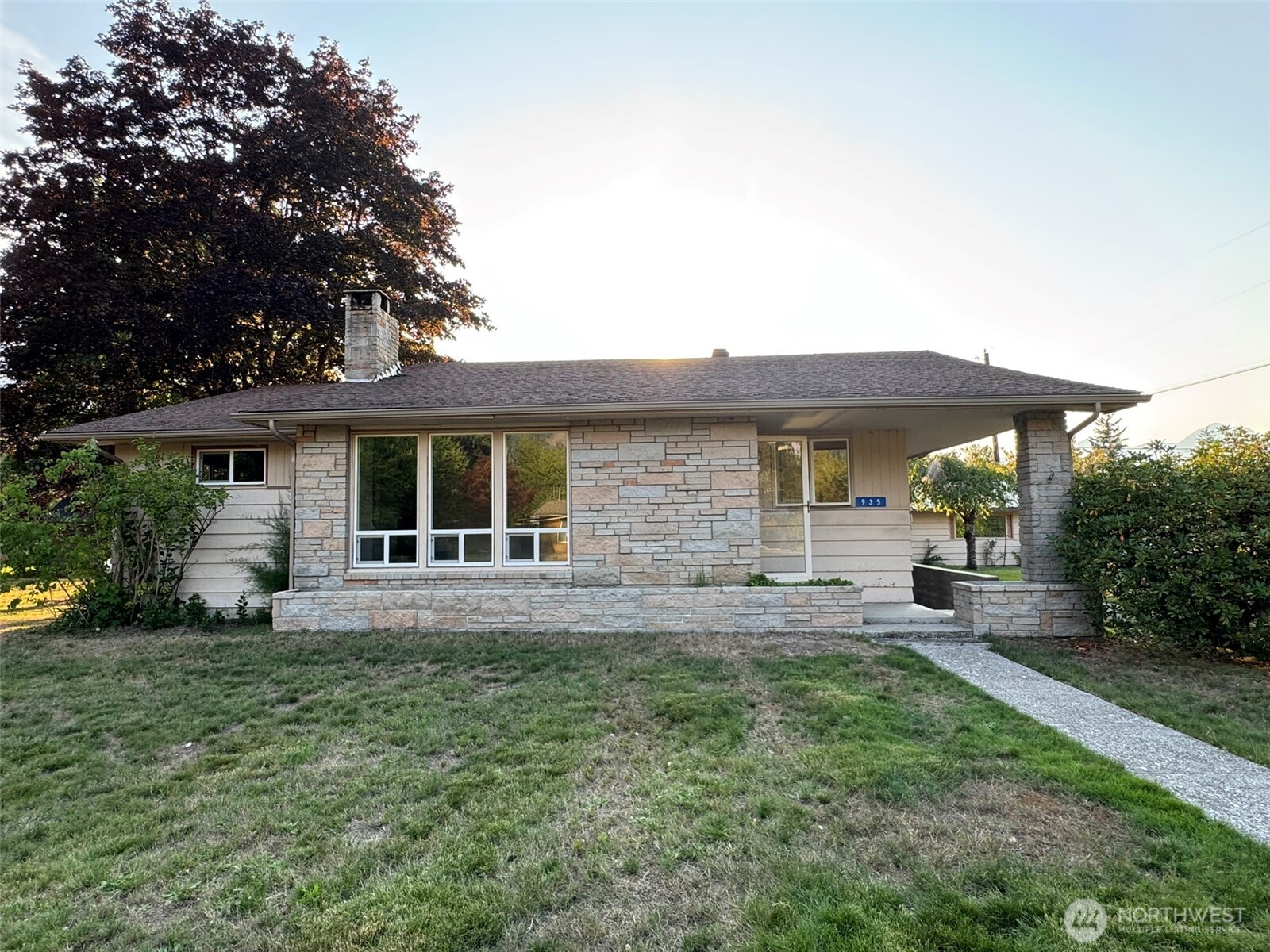 PRICE ADJUSTMENT!! - LARGE RAMBLER ON 5 CITY LOTS, ON THE MARKET FOR THE FIRST TIME IN 50+ YEARS!  Kitchen, LR, BRs & BTHRMs all located on main level, w/unlimited potential for more living space in the large basement w/separate entrance (rentable?), wood burning FP & decommissioned plumbing in prev bathrm. Updates include: kitchen appliances (all stay!), plumbing, electrical panel, septic tank, on-demand hot water & heating system, interior paint & chimney liner. LOADS of built-in storage, sunroom, cedar closets, garage w/hobby rm, corner lot, mountain views, mature fruit trees & landscaping!  Enjoy the added privacy of .44 acres or possibly resell a couple of the lots! So much to offer in this move-in-ready rambler! Buyer verify all.