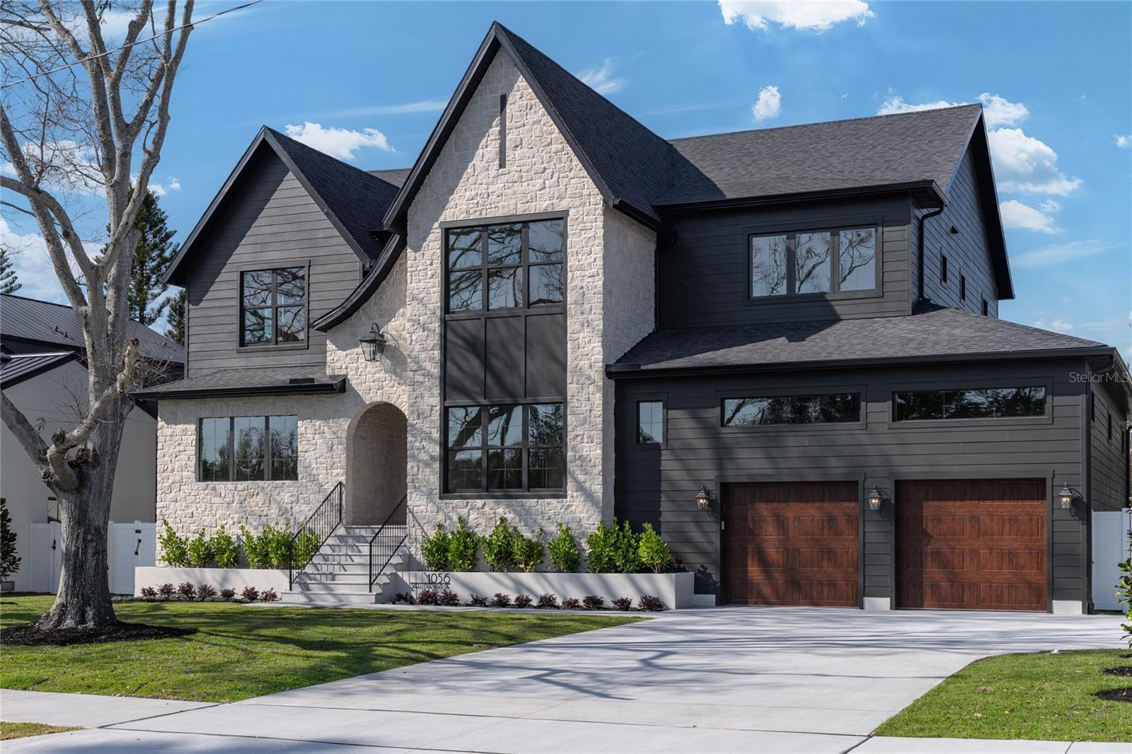 Exquisite Modern Tudor Estate in Snell Isle.

     Welcome to 1056 Snell Isle Blvd NE, where timeless elegance meets modern luxury. This stunning custom-built home offers an unparalleled blend of sophistication, craftsmanship, and state-of-the-art design in one of St. Petersburg’s most coveted neighborhoods.

     Step inside to soaring 26-foot vaulted ceilings in the grand living room, accentuated by custom ceiling details, built-ins, and designer cabinetry throughout. With six spacious bedrooms and 5.5 beautifully appointed baths, this home is designed for both lavish entertaining and everyday comfort.

     The gourmet kitchen is a chef’s dream, featuring high end cabinetry, paneled appliances, large scullery and pantry, and a seamless flow to the expansive outdoor living space. Outside, enjoy Florida living at its finest with a custom pool and hot tub, a fully equipped outdoor kitchen, and a generous backyard—perfect for gatherings or quiet relaxation.

     Built to the highest standards of safety and efficiency, this home boasts impact-rated windows and doors, energy-efficient spray foam insulation, and compliance with all current hurricane codes. A spacious three-car garage completes this extraordinary property.

     Nestled in the prestigious Snell Isle community, this masterpiece offers both privacy and proximity to vibrant downtown St. Petersburg, world-class dining, and waterfront parks.



Experience a new level of luxury—schedule your private tour today.