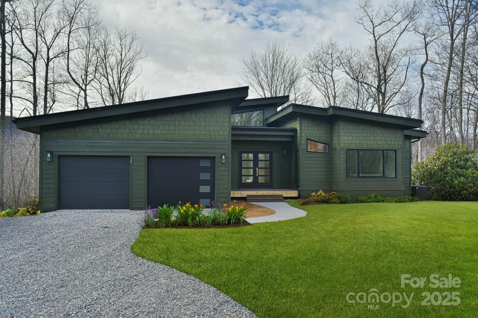 Modern Equestrian Living in the Heart of Fairview. Experience the perfect blend of modern design and mountain living on this stunning 9+ acre Fairview property — where luxury meets lifestyle and the possibilities are endless.
Designed with today’s homeowner in mind, this proposed modern build offers a thoughtfully crafted layout that balances open-concept living with private retreats. Step inside to find main-level living that flows effortlessly between indoor and outdoor spaces. Large windows capture the beauty of the surrounding mountains, filling each room with natural light and connecting you to the land that surrounds you. The interior is divided into multiple zones to suit every need — from quiet relaxation to lively gatherings. Whether you’re hosting family dinners or simply enjoying a peaceful evening, this home provides space for every moment.
The lower level is a true extension of the home’s versatility. Featuring a full kitchen and plenty of room for a pool table or media setup, this level is perfect for entertaining guests or creating a private in-law suite with its own entrance and amenities. Step outside, and you’ll understand why Fairview is one of the most desirable communities near Asheville. This property is ready for your horses — with beautiful pasture land, sturdy fencing,  and a six-stall barn designed for comfort and functionality. A thoughtfully designed track system promotes healthy movement, ensuring your horses live as happily as you do. Here, you can enjoy true country living without sacrificing convenience. You’re just 15 minutes from downtown Asheville, where you can explore award-winning restaurants, breweries, and boutiques — then return home to the peace and privacy of your own mini-estate. Whether you’re looking to start your dream equestrian property, host family gatherings, or simply soak in the mountain views from your back deck, this home offers the best of both worlds — modern elegance and rural charm. Bring your horses, your furniture, and your dreams — this Fairview gem has it all.