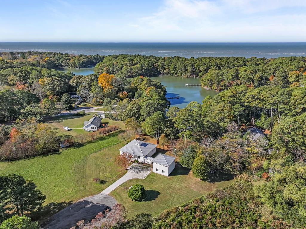 Welcome to this beautifully renovated WATERFRONT (HUNGARS CREEK), 3 bed, 2 bath home with a spacious bonus room over the garage with separate access. Use it as an in-law suite, art studio or extra bedroom. High and Dry- NO FLOOD INSURANCE REQ. Perfectly situated in the sought-after Vaucluse Shores. Enjoy deeded deep-water access and a community boat ramp, perfect for boating, fishing and enjoying the Chesapeake Bay. Neighborhood  amenities include a pool, exercise room, tennis courts, and a private, well-maintained beach- just minutes from your front door. Enjoy coffee on your back porch watching the boats go by and the serene wildlife. 50 yr Metal Roof, Newer Stove/Micro, and Never HVAC, Broadband Fiber Optic Internet, Spray Foam Insulation, and Encapsulated Crawl.