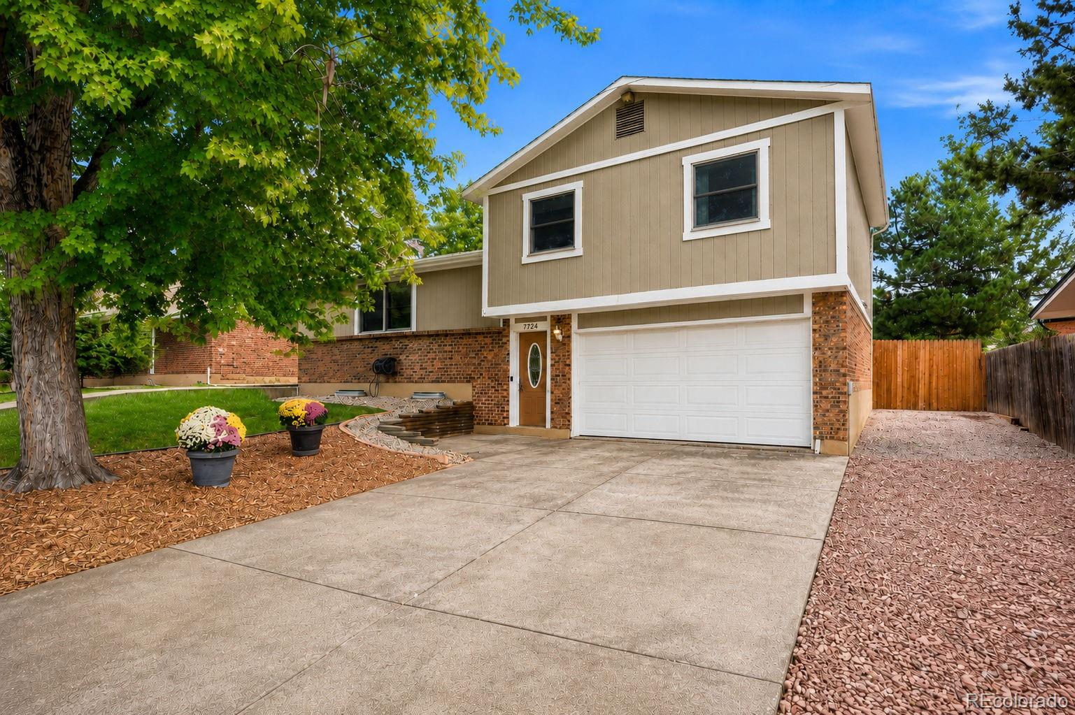More than beautifully updated—this is a home that has been thoughtfully improved inside, outside, and behind the scenes. Set on a fully fenced .17-acre lot in Dakota Station, this 3 bedrooms, 3 baths, multiple living areas, and a long list of improvements designed for comfort, function, and easy living.Fresh paint and new flooring create a clean, cohesive feel throughout. The bright main living area flows into an updated kitchen with butcher-block counters and oversized pantry storage, while the spacious lower-level family room adds valuable flexibility for a second living space, media room, guest bedroom, playroom, or home office.Recent improvements include all new irrigation system, new insulation, exterior paint, and electrical upgrades—investment in both the visible finishes and the systems that matter after move-in.Parking is exceptional for the neighborhood. The attached 437+ square-foot 2-car garage includes wiring for EV charging, plus there is a dedicated RV space and an additional off-street parking area.Out back, the fully fenced yard offers a deck, fire pit, garden space, established landscaping, and irrigation. One of the home's best surprises is the detached flex building with electricity, heat, A/C, and water—ideal for hobbies, projects, a workshop, creative space, or work-from-home overflow.Central air, generous storage, multiple parking options, and no HOA complete a property that offers far more than a cosmetic remodel. Move-in ready, extensively improved, and packed with hard-to-duplicate features, 7724 S Hoyt Street offers exceptional flexibility and function.