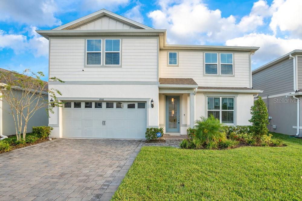Welcome to your dream home in the highly sought-after Pinewood Reserve community! This stunning 2-story, 4-bedroom, 3.5-bathroom home offers the perfect blend of luxury and modern living. Situated on a premium lot with serene pond views, this home is packed with thoughtful upgrades that set it apart. Step into the GOURMET KITCHEN with an oversized island with upgraded white cabinetry, QUARTZ countertops, and built-in stainless steel appliances—perfect for any culinary enthusiast. The open floor plan seamlessly connects the kitchen to the spacious gathering room, making it ideal for entertaining. The home’s UPGRADED lanai with large sliding doors opens to the backyard, providing uninterrupted views of the pond and conservation area, perfect for outdoor relaxation. The first-floor owner’s suite includes an UPGRADED master bathroom and a custom-designed walk-in closet. Upstairs, the additional bedrooms all feature CUSTOM CLOSETS, offering plenty of storage. Thoughtful design details like accent walls in the living room and office add an extra layer of sophistication. This ENERGY EFFICIENT home is also equipped with FULLY PAID OFF solar panels (7.6 kW system), generating over 1,000 kWh per month and covering the electric bill. A paid-off ADT security system provides added peace of mind. Located just 15 minutes from Lake Nona, Orlando International Airport, Downtown Orlando, and Waterford Lakes, this home offers both luxury and convenience. Don’t miss the chance to make this exceptional property your own!
