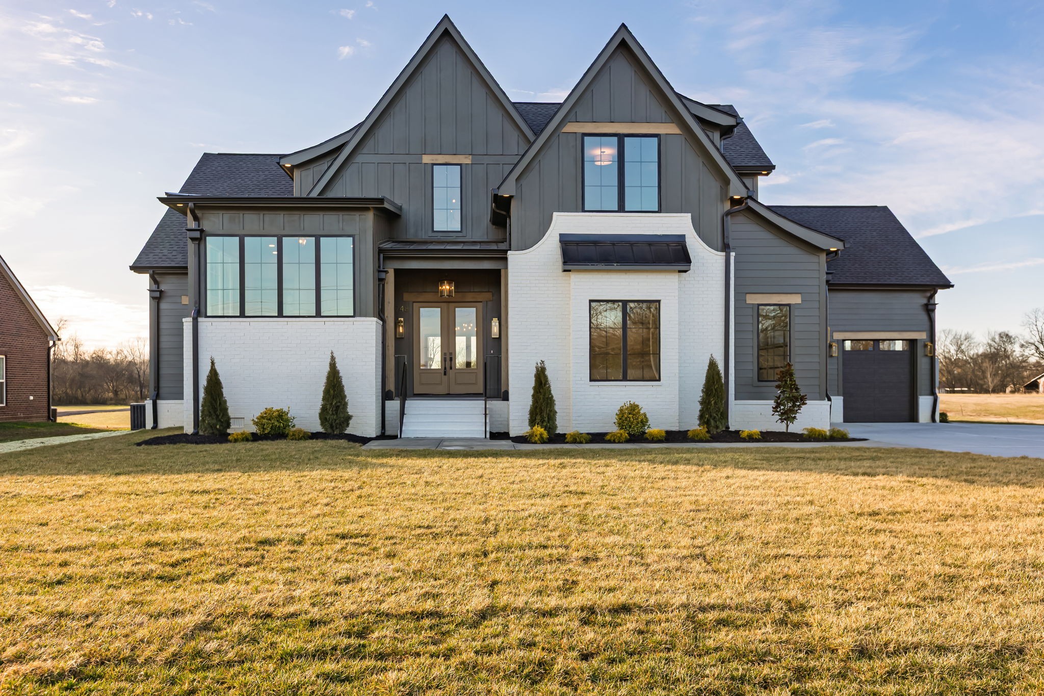 **$15k in seller paid closing costs with preferred lender.** Welcome to this stunning classic modern home that sits on just under 2 acres of land. Featuring 5 bedrooms, 4.5 baths, and a 3-car garage, this home blends functionality with timeless design. The main level features a spacious foyer with high ceilings, cedar beams throughout, a stone fireplace in the living room with built ins and a wood-burning fireplace on the covered back patio. The open kitchen features thoughtfully selected fixtures, a prep pantry with second sink and refrigerator space, a wet bar and tons of open shelving. Both the primary and guest suites on the main level have vaulted ceilings with cedar beams, with the primary featuring a massive walk-in closet with an island and a stunning primary bath with a soaking tub inside of the shower. Upstairs includes a spacious bonus room with a second wet bar, 3 bedrooms with each having access to a full bath. This beautiful home and private lot, are a perfect balance of craftsmanship, comfort, and modern style. Includes a 1-year build warranty.