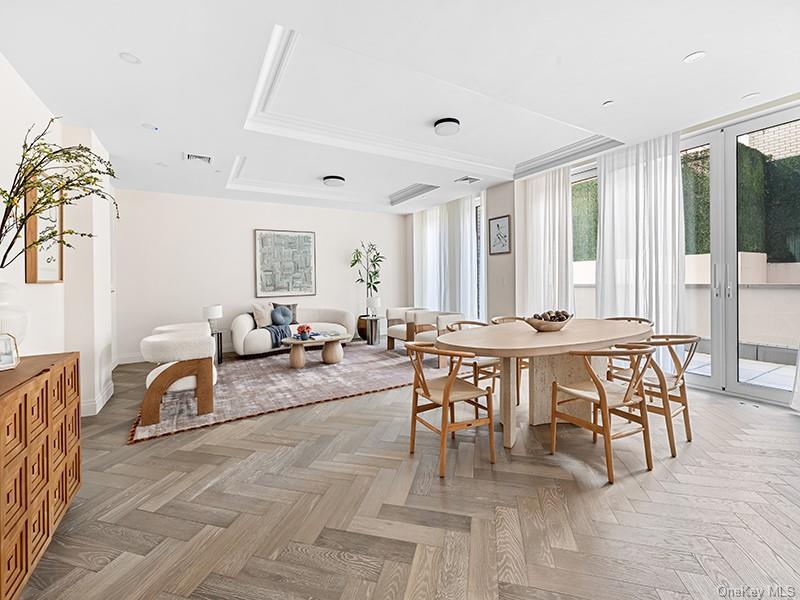 78-29 Austin StreetTownhouse 14Townhouse 14, part of The Austin’s premier Duplex Collection, is a 2,115 SF three-bedroom, three-bathroom home with a 350-square-foot private garden. With interiors by Italian design firm S20M, Townhouse 14 features dramatic ceiling heights up to 10 feet tall.White oak herringbone floors run throughout the main living spaces, while the spacious living room is highlighted by floor-to-ceiling triple-glazed windows, filling the home with natural light. The custom Scavolini kitchen features an integrated suite of Viking appliances, including an induction cooktop with Savalo stone hood, refrigerator, dishwasher, and microwave, as well as a Liebherr wine refrigerator with a 75-bottle capacity. Glass upper cabinets with undermount lighting are paired with sleek quartz countertops, blending elegance and functionality. A dedicated home office provides a quiet space for work or study.On the lower level, the primary bedroom suite offers a generous walk-in closet and access to a 350-square-foot private garden, creating a seamless indoor-outdoor experience. The spa-inspired five-fixture en-suite bathroom includes a dual Porcelanosa vanity, Robern medicine cabinets, designer wall sconces, and a wall-mounted Toto toilet. Two additional bedrooms feature ample closet space and share a well-appointed secondary bathroom.Townhouse 14 is equipped with a vented washer and dryer and a dedicated entry closet, while the private concierge closet provides the ultimate convenience. Nestled in the charming Forest Hills neighborhood, The Austin is a remarkable collection of 98 condominium residences. A transformative new development where every detail is exquisitely designed from the ground up, The Austin transcends the condominium status quo with outstanding craftsmanship and world class amenities, surrounded by abundant tranquil green spaces. Spanning Austin Street to Kew Forest Lane, this offering rivals anything else found in Queens.The Austin offers a refined collection of resort-style amenities designed to enhance everyday living. Residents are welcomed by a full-time doorman and concierge, with inviting spaces including a residents’ lounge with garden views, a residents’ library, and a vibrant children’s playroom and music room. The state-of-the-art fitness center features cardio and strength equipment, a stretching studio, spa, and indoor basketball court. Two fully amenitized rooftop levels include an outdoor saltwater junior Olympic pool, pickleball court, outdoor cinema, and outdoor kitchen and dining areas with panoramic views of Manhattan and Queens. Additional conveniences include a live-in superintendent, pet spa, as well as private parking and private storage available for purchase.The complete offering terms are in the offering plan available from Sponsor, 78-29 Austin Street Holdings LLC, having an address at 227 Sea Breeze Avenue, 4th fl., Suite C-403, Brooklyn, NY 11224, File No. CD23-0253. All artist’s renderings are for representational purposes only and are subject to variances. Finishes depicted in the artist’s renderings are not necessarily indicative of what will be specified in the offering plan and not all items included in the artist’s renderings are included in unit purchase. Equal Housing Opportunity.