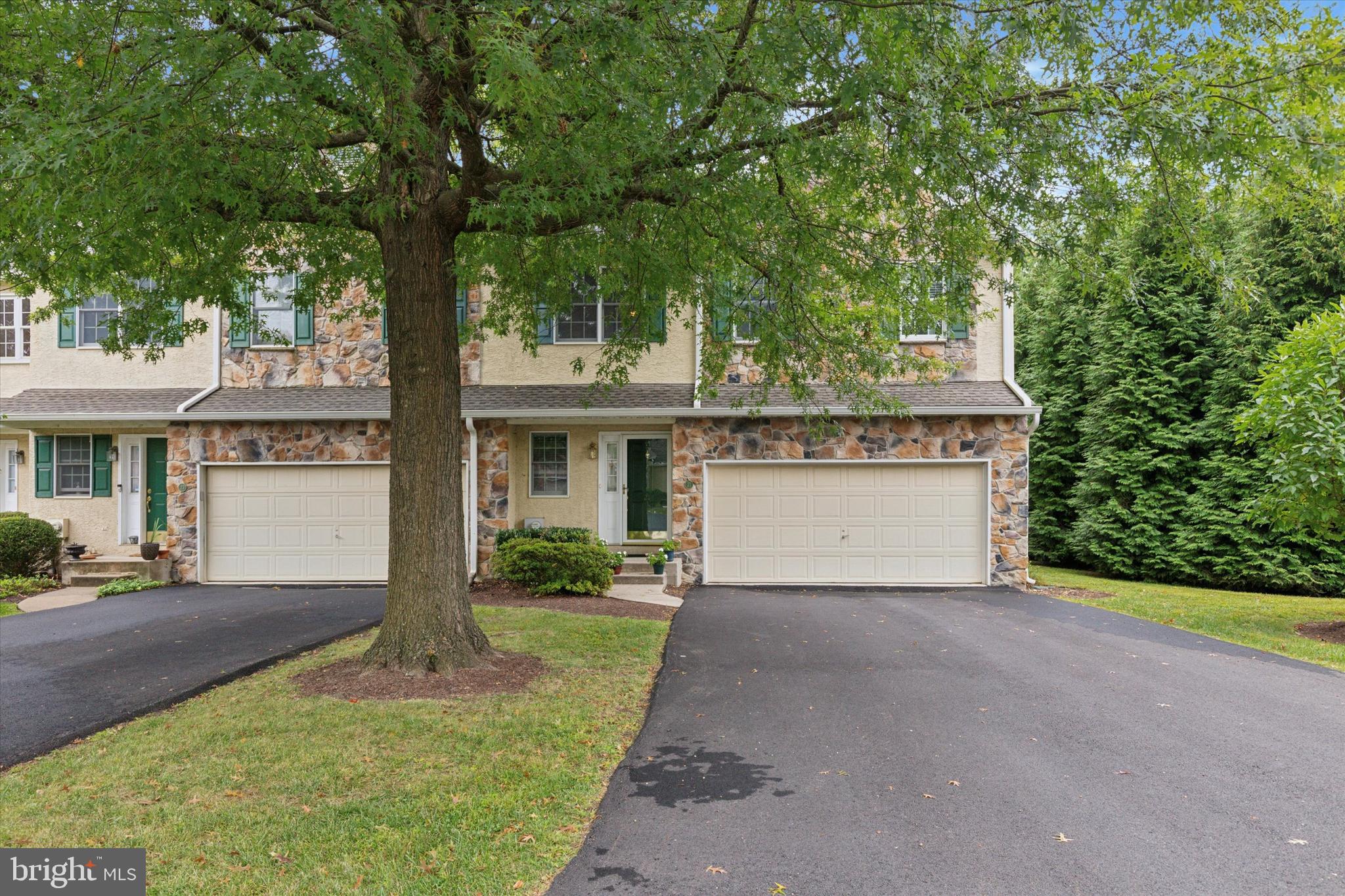Move right into this beautifully maintained end-unit townhome in the highly sought-after Erin Glen community, located within the award-winning Great Valley School District! Lovingly cared for by its owners, this spacious 3-bedroom, 2.5-bath home offers a bright, open floor plan designed for both comfortable everyday living and effortless entertaining.The welcoming main level features generous living and dining spaces, highlighted by abundant natural light and seamless flow throughout. The kitchen boasts refreshed countertops, newer flooring, ample cabinetry, and plenty of prep space, making it the heart of the home. Just beyond, step outside to the expanded deck overlooking a peaceful, tree-lined backyard—an ideal setting for morning coffee, summer barbecues, or simply relaxing in a private outdoor retreat.Upstairs, you'll find three spacious bedrooms, including a generously sized primary suite with an en-suite bath and abundant closet space. Thoughtful updates, including new wood interior doors, add warmth and style throughout the home.Need additional space? The large unfinished basement offers endless possibilities for storage, a home gym, workshop, or future finished living area.The home also features a spacious attached two-car garage, providing plenty of room for parking, storage, and everyday convenience.As an end-unit, you'll enjoy added privacy, extra windows, and a beautifully landscaped setting. Conveniently located near major commuter routes, shopping, restaurants, parks, and all that the Great Valley area has to offer, this move-in ready home is one you won't want to miss!