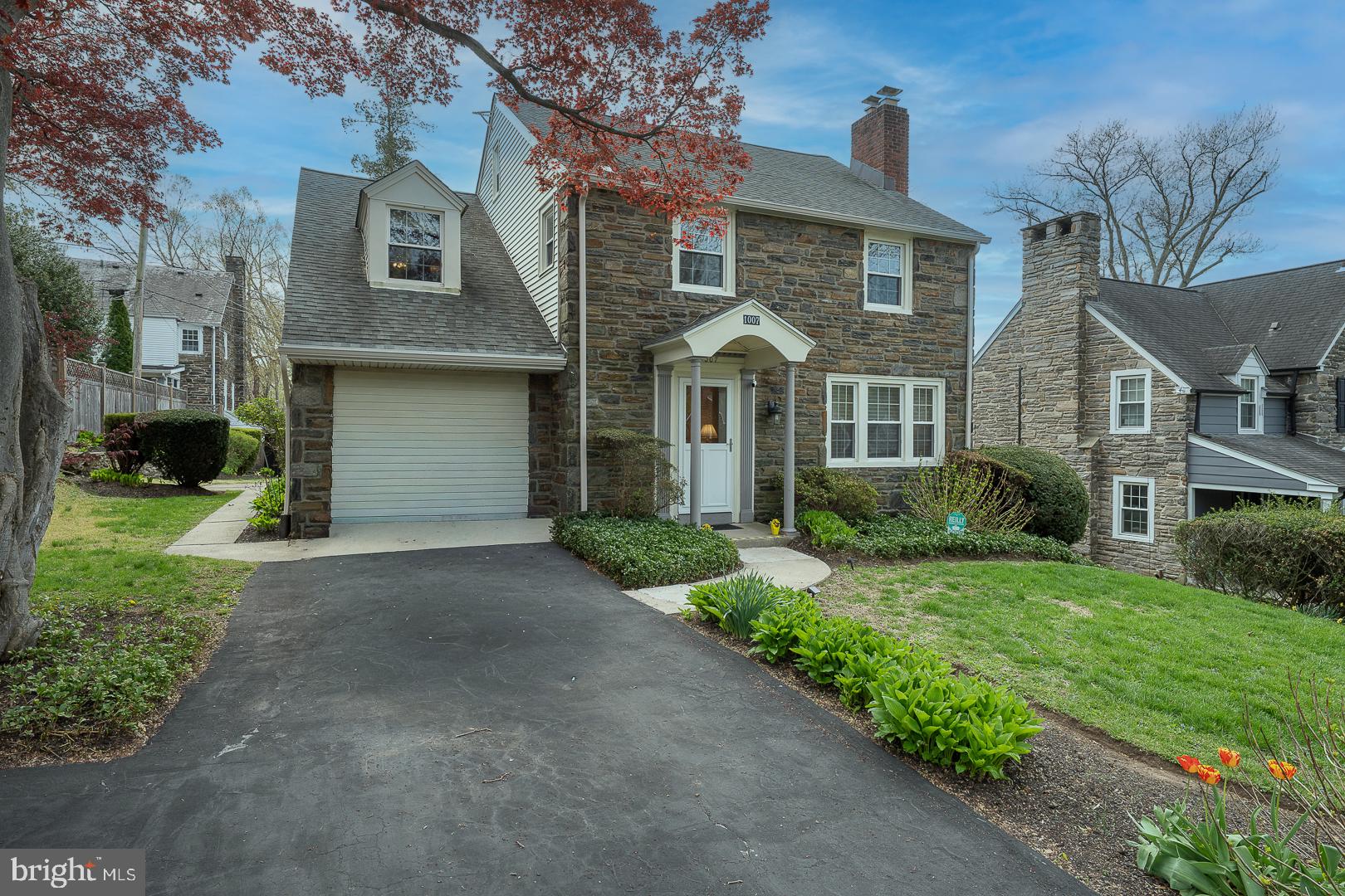 Welcome to 1007 Hampstead Rd in Wynnewood, a beautifully maintained 3-bedroom, 3 full and 1 half bath home that has been lovingly cared for and is ready to begin its next chapter. A bright and inviting formal living room greets you upon entry, featuring a cozy gas fireplace. The formal dining room, complete with hardwood floors and classic chair rail, is ideal for both everyday meals and entertaining guests. The spacious kitchen offers abundant workspace, including a peninsula, extensive cabinetry, granite countertops, and gas cooking. A charming breakfast room and large pantry/storage area add both convenience and functionality. Just off the kitchen, you’ll find a comfortable den with built-in bookshelves, perfect for relaxing or working from home. A convenient half bath and access to the expansive timber tech deck, with a remote retractable cover, make indoor-outdoor living effortless. The deck overlooks a lovely backyard, providing a peaceful setting for gatherings or quiet enjoyment. Upstairs, the primary suite features two large closets and a full ensuite bathroom. Two additional bedrooms share a full hall bath, which conveniently includes laundry. The third-floor attic offers bonus space, ideal for a home office, playroom, or additional storage. The finished walkout lower level expands your living space with a family room, full bath, second laundry area, and ample storage.  Additional features include a whole-house generator, central air, keyless entry, new gutters with leaf guard, and a storage shed.  Ideally located near parks, trails, public transportation, shops, and restaurants, and situated within the highly regarded Haverford School District.  This home offers comfort, space, and convenience in a sought-after location.