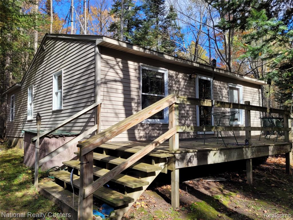 Two Cabins on 20 Wooded Acres with Au Gres River Frontage! Experience the beauty of northern Michigan at 8109 M-55 in Whittemore. Conveniently located between West Branch and Tawas City. This one-of-a-kind property is perfect for anyone who loves nature, privacy, and year-round outdoor adventure — all with paved road access. The main cabin features 920 sq ft of comfortable living space with 2 bedrooms, 1 finished bath, and a 2nd bath ready for completion (needs shower, toilet, and sink). The living room and kitchen offer a warm, open feel, and the spacious deck provides the perfect spot to take in the peaceful surroundings. The guest cabin (327 sq ft) includes a sleeping area, kitchenette, and bath — ideal for family, friends, or rental income. A pond between the two homes adds to the tranquil setting, and a shed with lean-to provides convenient storage for outdoor gear and equipment. Located in Iosco County, this property puts you near Huron National Forest, Lake Huron beaches, ORV trails, and year-round recreation including snowmobiling, fishing, hunting and kayaking. Whether you’re looking for a quiet weekend retreat, hunting camp, or full-time country living, this property offers endless possibilities in a serene northern Michigan setting. Year built is unknown. Site dimensions are estimated. (ONX PROPERTY DIMENSIONS ARE INCORRECT. SEE ATTACHED PHOTO) Use caution on main house deck. Buyer to verify all information.